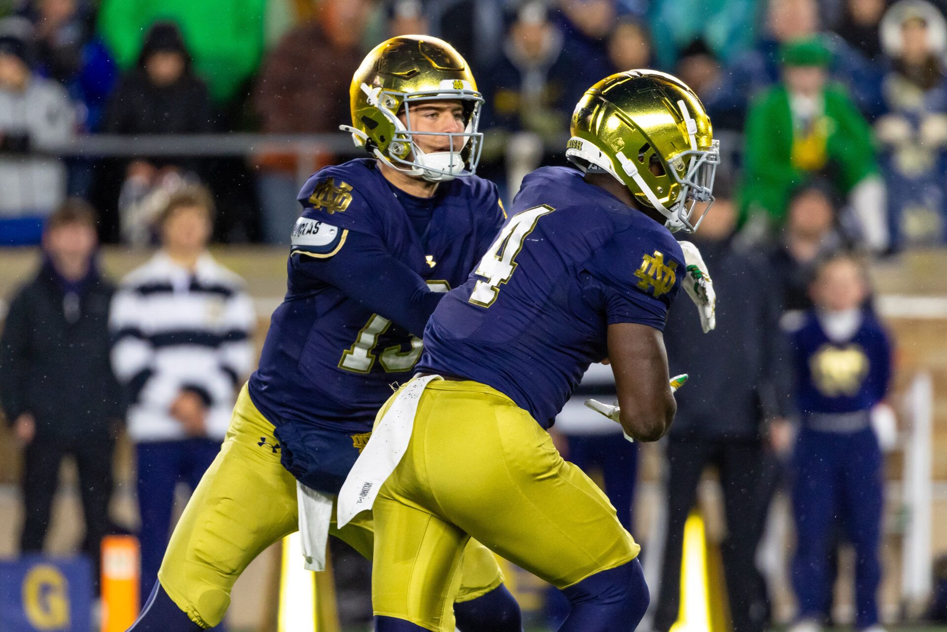 Notre Dame Fighting Irish quarterback CJ Carr (13) hands off to running back Jeremiyah Love (4) against the Navy Midshipmen during the first half at Notre Dame Stadium.