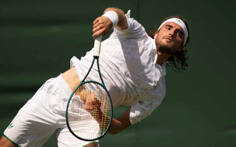 Stefanos Tsitsipas of Greece serves during his match against Valentin Royer of France on day one at the All England Lawn Tennis and Croquet Club.