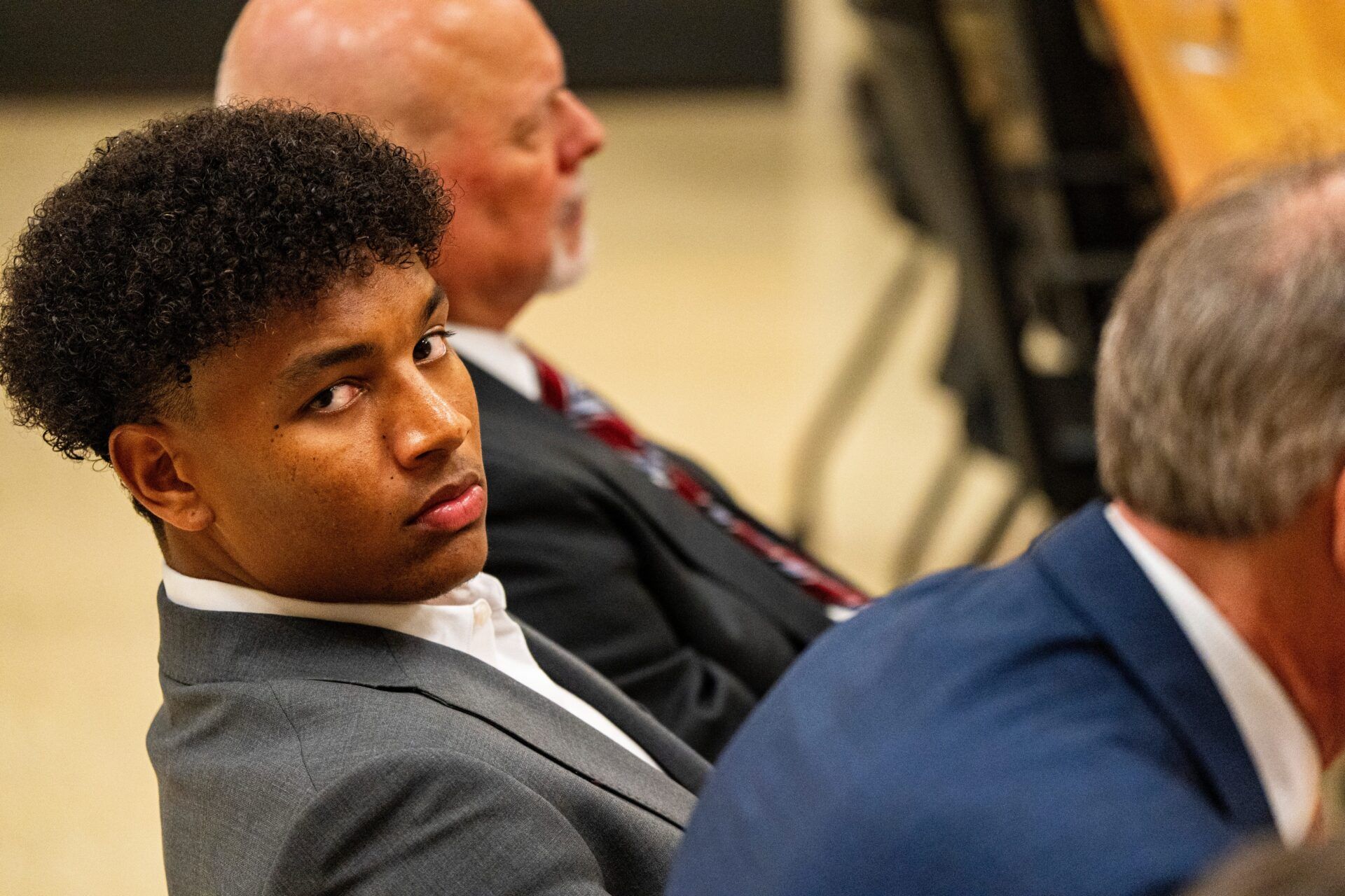 Ole Miss quarterback Trinidad Chambliss looks over at members of the press during the hearing of Chambliss in his lawsuit against the NCAA at Calhoun County Courthouse in Pittsboro, Miss., on Thursday, Feb. 12, 2026. Chambliss was granted a preliminary injunction against the NCAA.