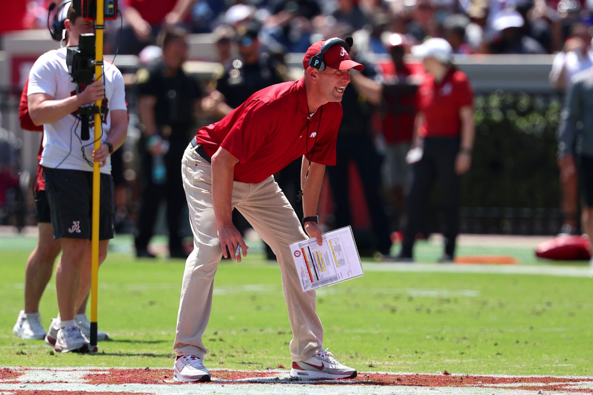 Alabama Crimson Tide head coach Kalen DeBoer calls a play during the Alabama A-Day spring football scrimmage game at Saban Field at Bryant-Denny Stadium.