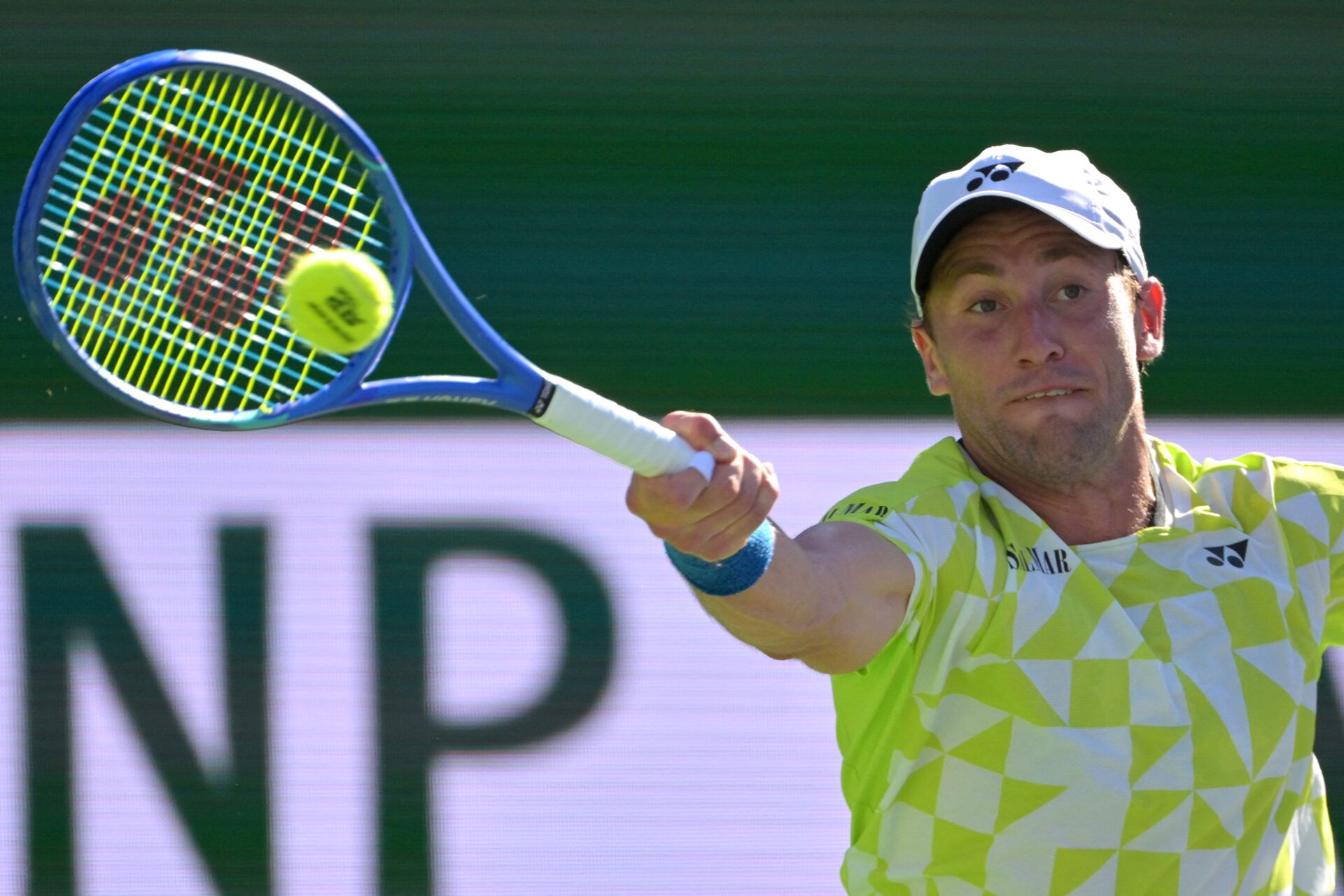 Casper Ruud (NOR) hits a shot during the fourth round match against Carlos Alcaraz (ESP) in the BNP Paribas Open at the Indian Wells Tennis Garden.