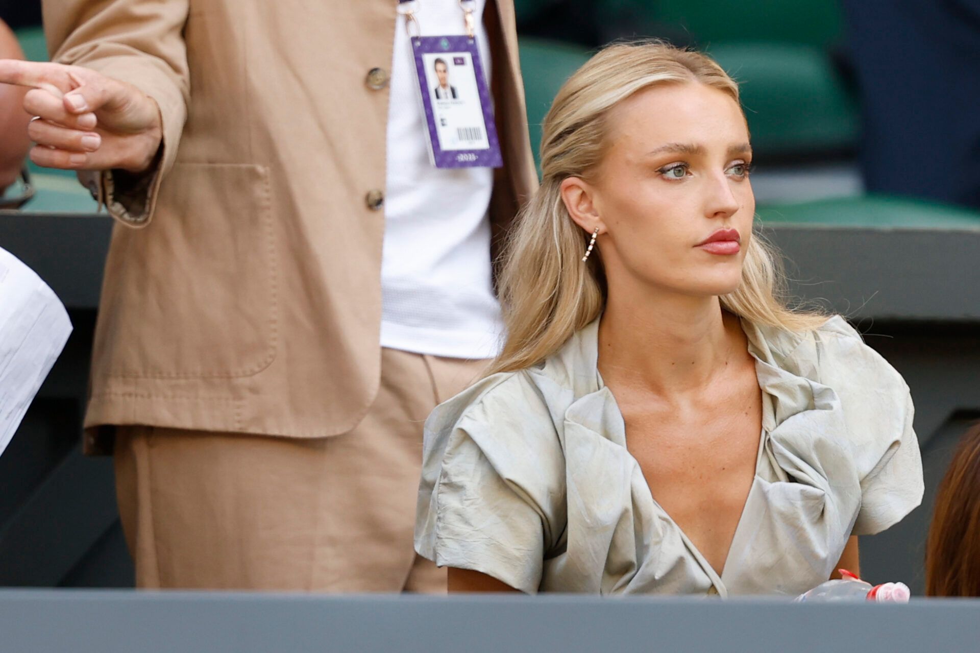 Morgan Riddle, girlfriend of Taylor Fritz (USA)(not pictured), sits in his player's box prior to the match against Carlos Alcaraz (ESP)(not pictured) in a gentlemen's singles semi-final on day twelve of The Championships Wimbledon 2025 at All England Lawn Tennis and Croquet Club.