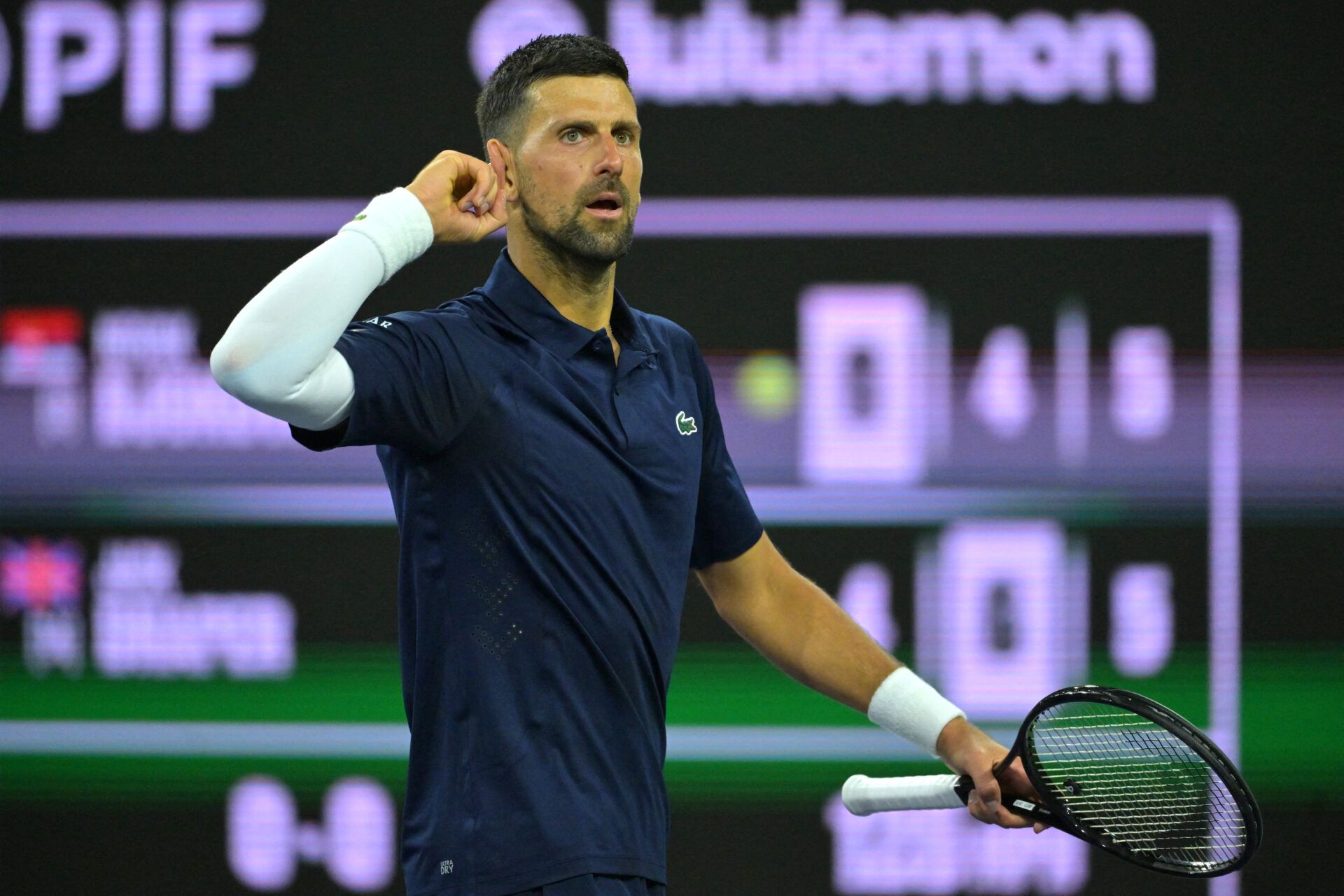 Novak Djokovic (SRB) hits a shot during his fourth round match against Jack Draper (GBR) in the BNP Paribas Open at the Indian Wells Tennis Garden.