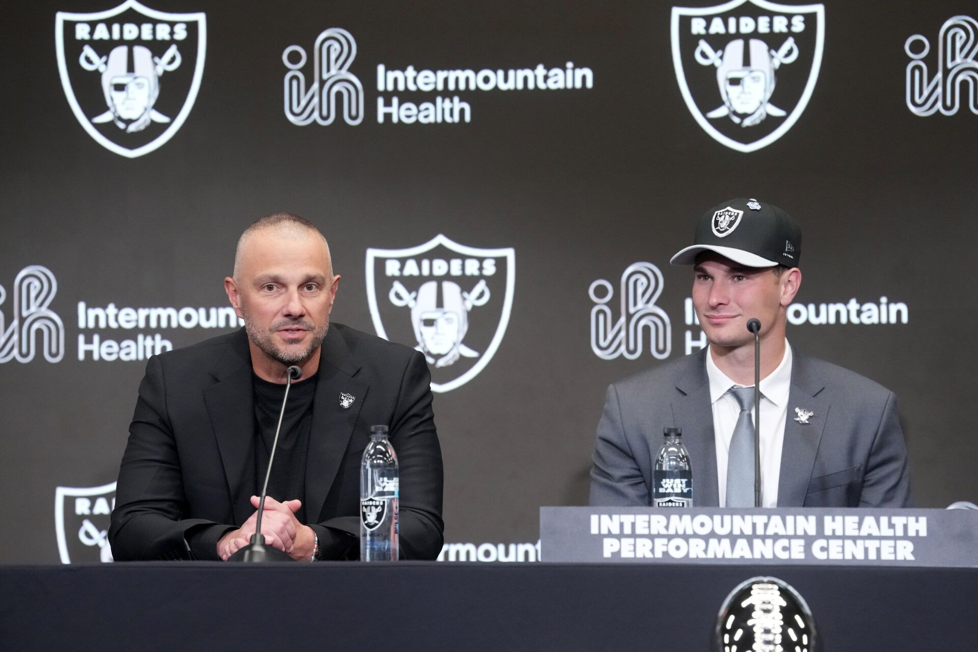 Las Vegas Raiders quarterback Fernando Mendoza (right) and general manager John Spytek at introductory press conference at Intermountain Health Performance Center after being selected as the No. 1 pick in the 2026 NFL Draft.