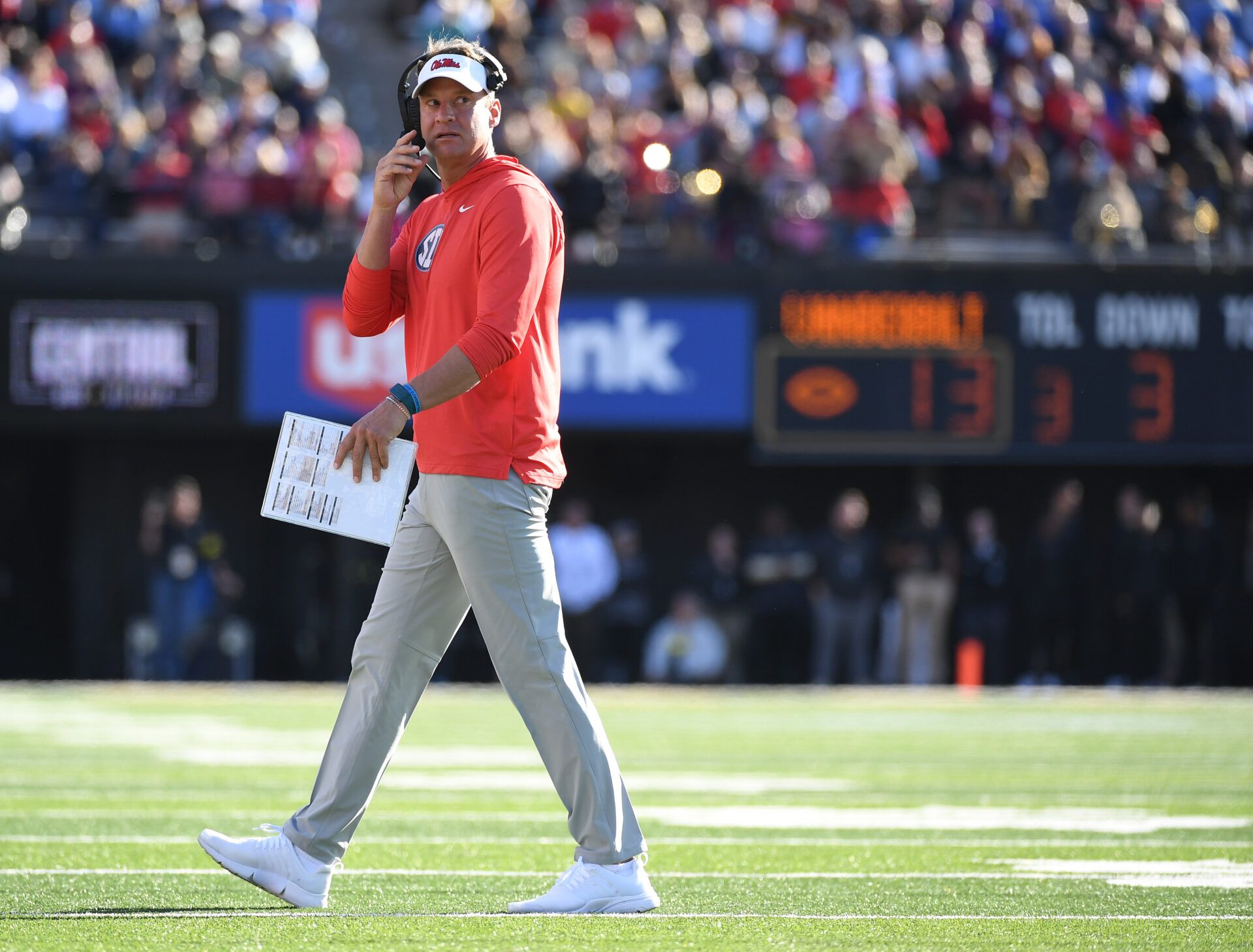 Mississippi Rebels head coach Lane Kiffin walks off the field after a timeout during the first half against the Vanderbilt Commodores at FirstBank Stadium.