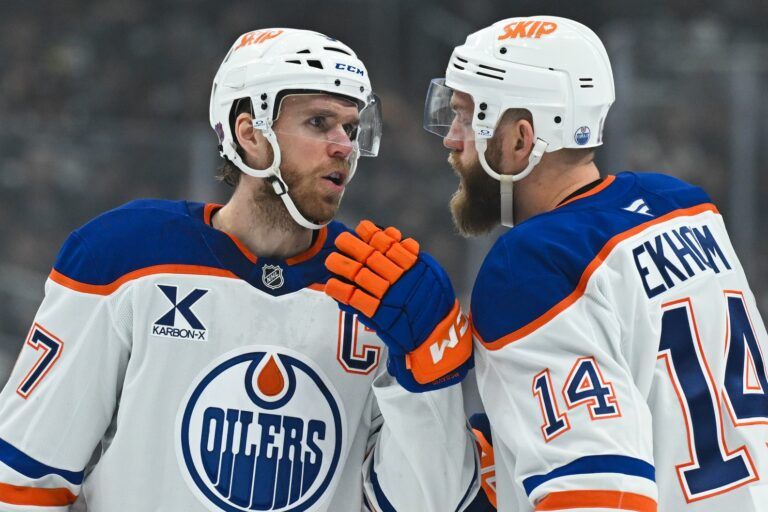 Edmonton Oilers center Connor McDavid (97) talks to Edmonton Oilers center Adam Henrique (19) during the first period between the Edmonton Oilers and the Los Angeles Kings at Crypto.com Arena.