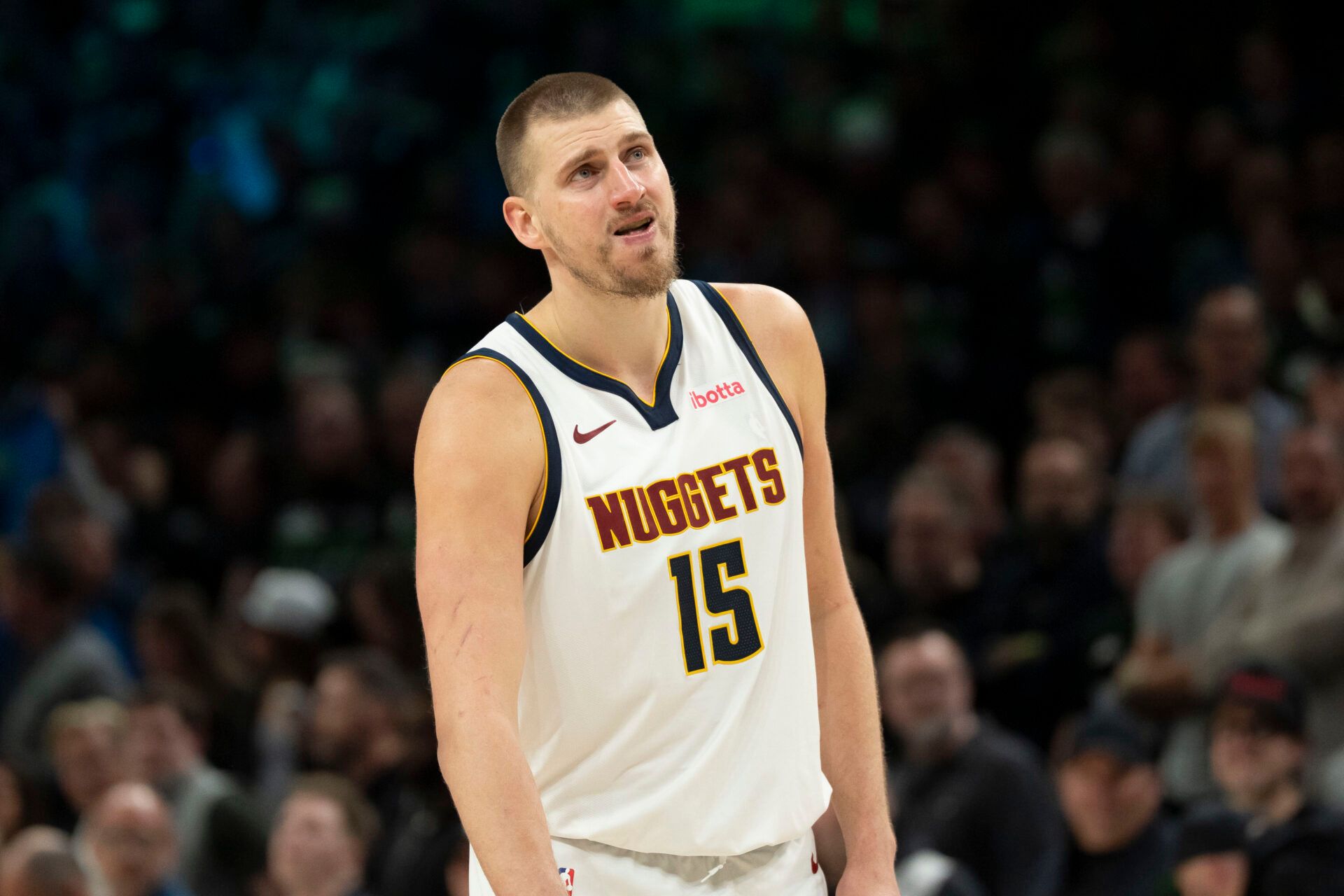 Denver Nuggets center Nikola Jokic (15) looks on against the Minnesota Timberwolves in the second half during game six of the first round of the 2026 NBA Playoffs at Target Center.