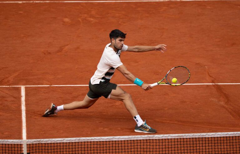 Carlos Alcaraz of Spain returns a shot during the mens singles final against Jannik Sinner of Italy5on day 15 at Roland Garros Stadium.