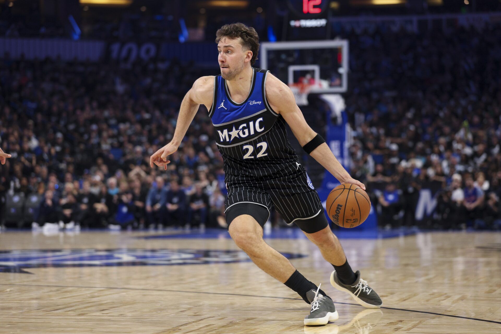 Orlando Magic forward Franz Wagner (22) controls the ball against the Detroit Pistons in the fourth quarter during game three of the first round of the 2026 NBA Playoffs at Kia Center.