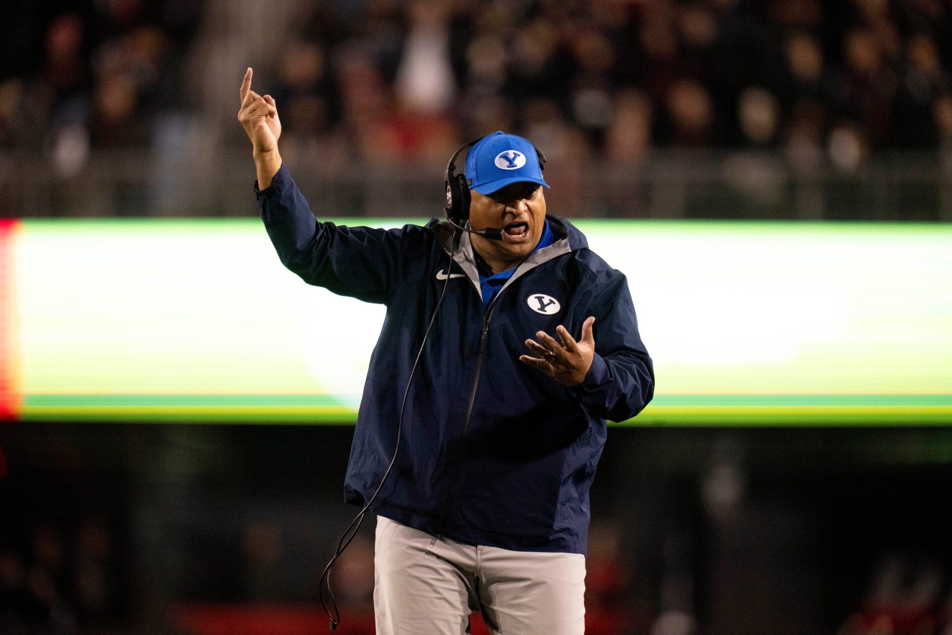 BYU Cougars head coach Kalani Sitake coaches in the fourth quarter of the NCAA football game between the Cincinnati Bearcats and BYU Cougars at Nippert Stadium in Cincinnati on Nov. 22, 2025.