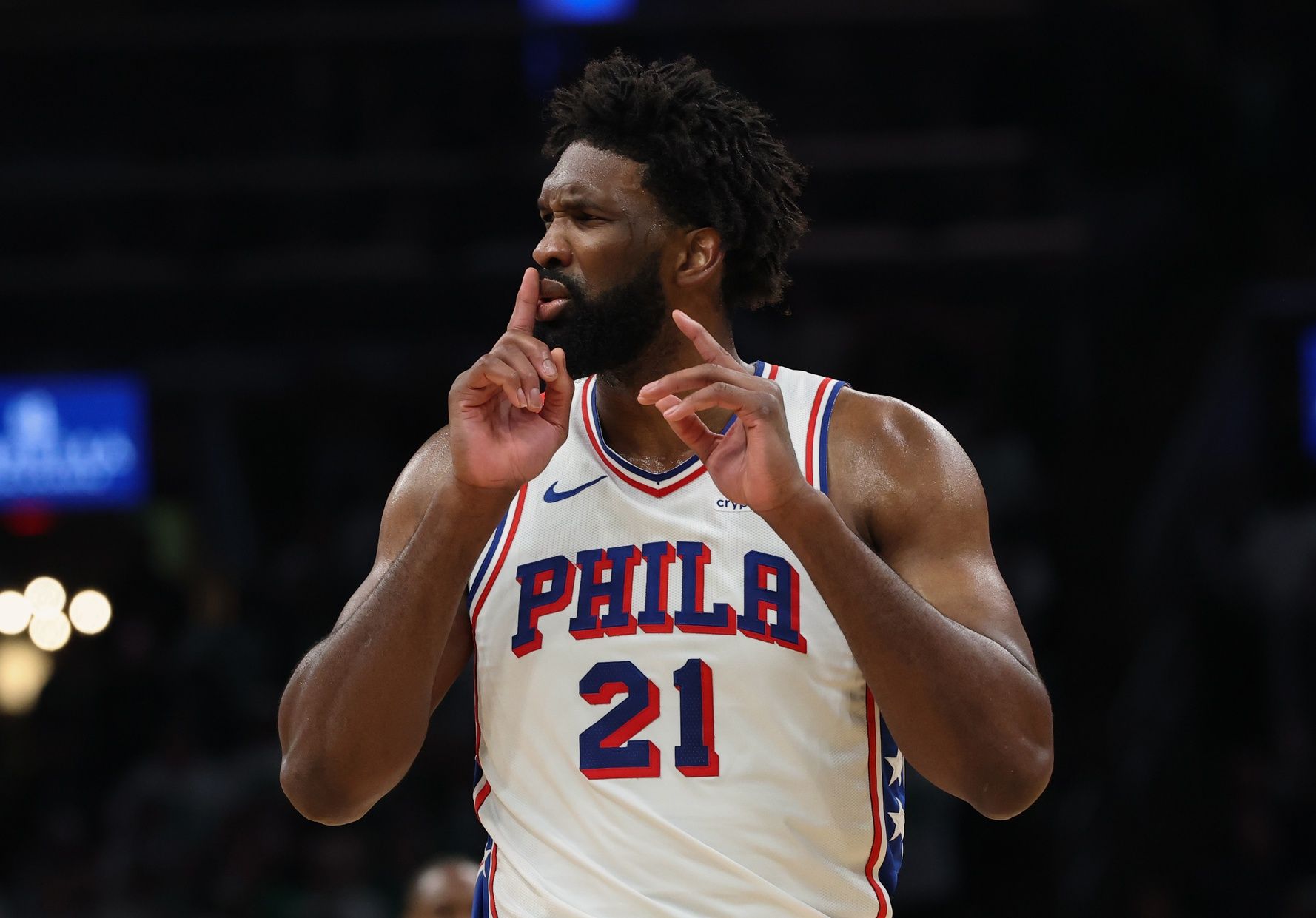 Philadelphia 76ers center Joel Embiid (21) silences the crowd after making a shot against the Boston Celtics during the second quarter of game seven of the first round of the 2026 NBA Playoffs at TD Garden.
