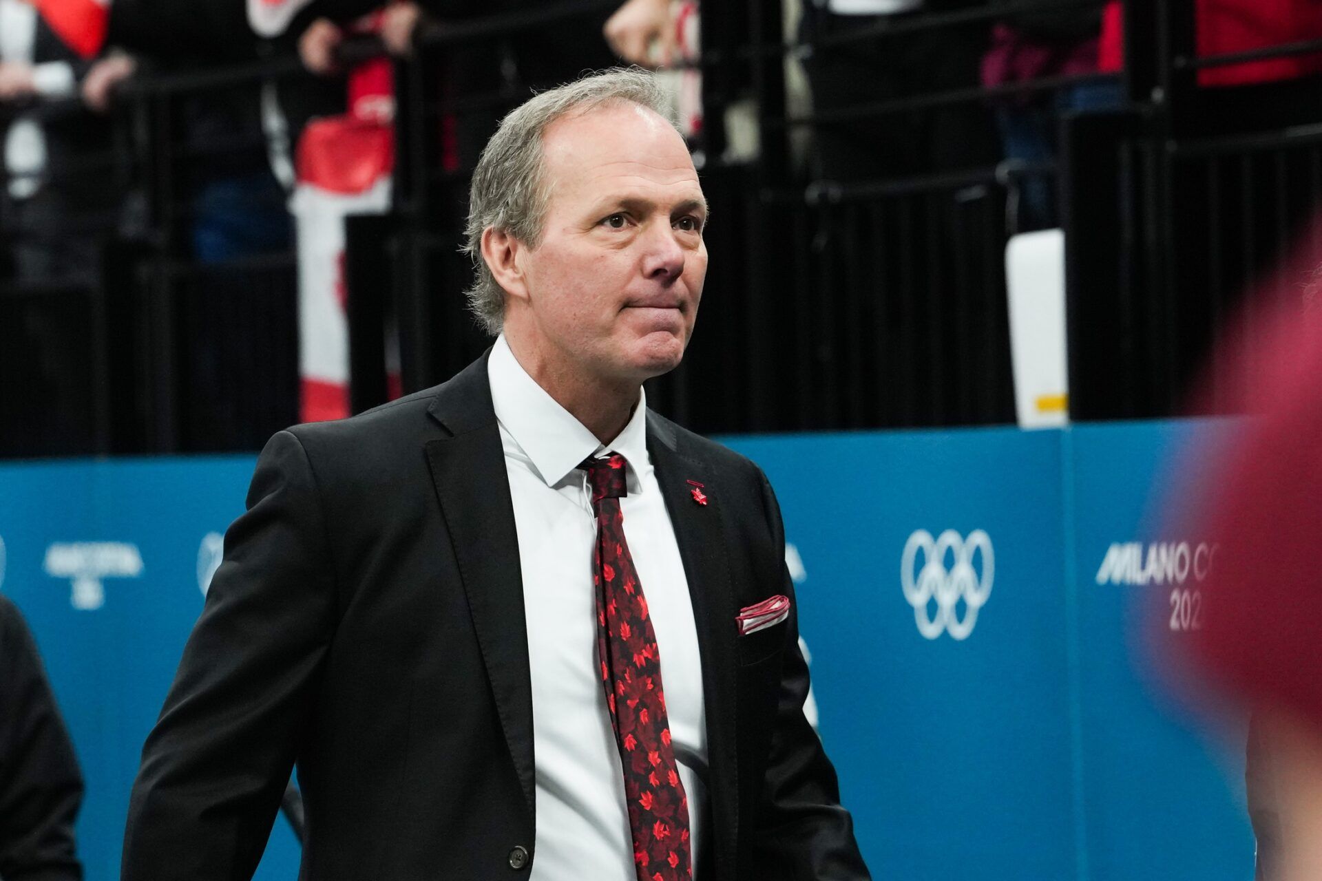 Jon Cooper of Canada looks on after the game against Finland in a men's ice hockey semifinal during the Milano Cortina 2026 Olympic Winter Games at Milano Santagiulia Ice Hockey Arena.