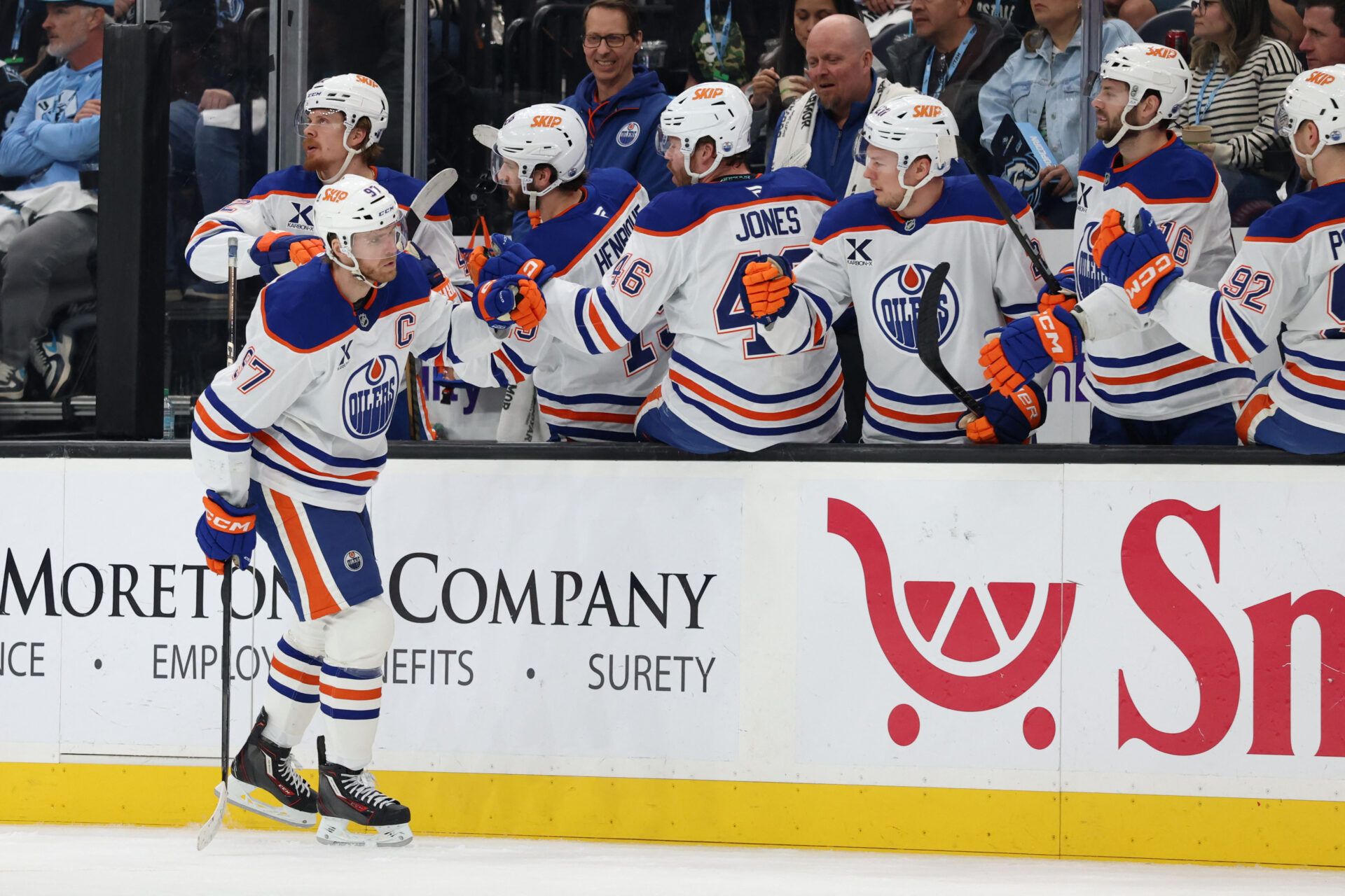 Edmonton Oilers center Connor McDavid (97) celebrates with the bench player at Delta Center.