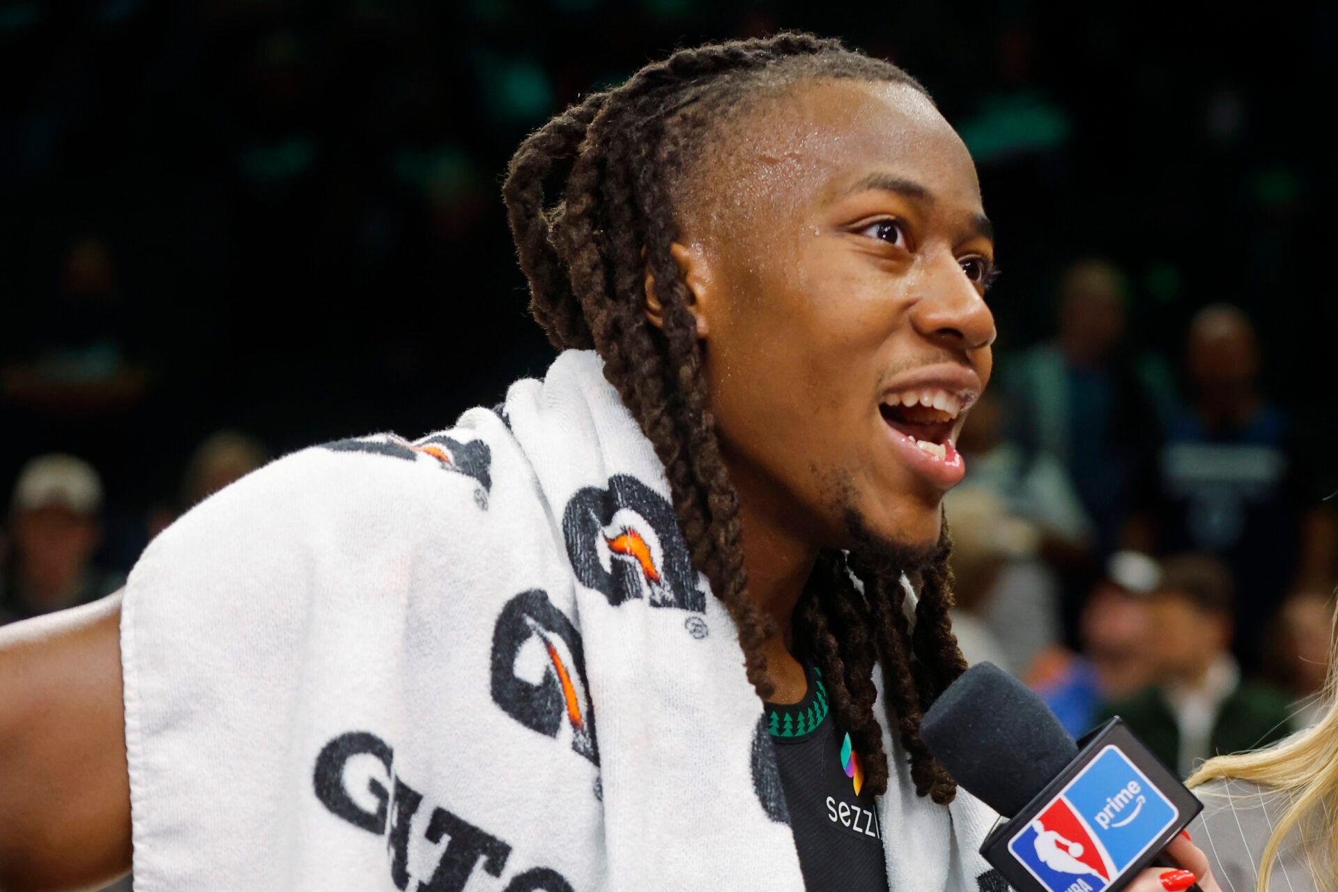 Minnesota Timberwolves guard Ayo Dosunmu (13) talks with a reporter after the game with the Denver Nuggets at Target Center.
