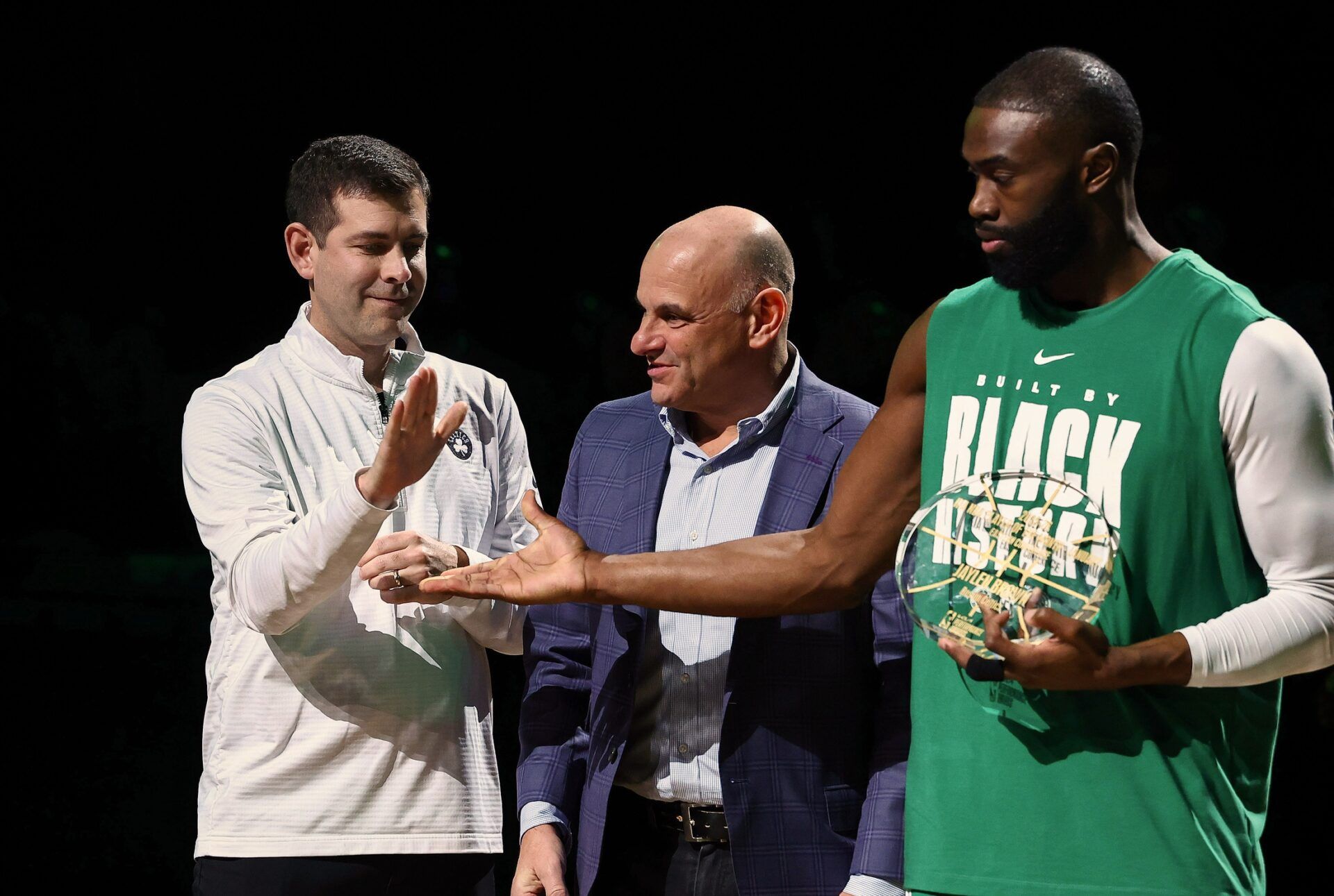 Brad Stevens the president of basketball operations for the Boston Celtics congratulates guard Jaylen Brown (7) for receiving the NBA player of the month award for his performance in the month of January before their game against the Chicago Bulls at TD Garden.