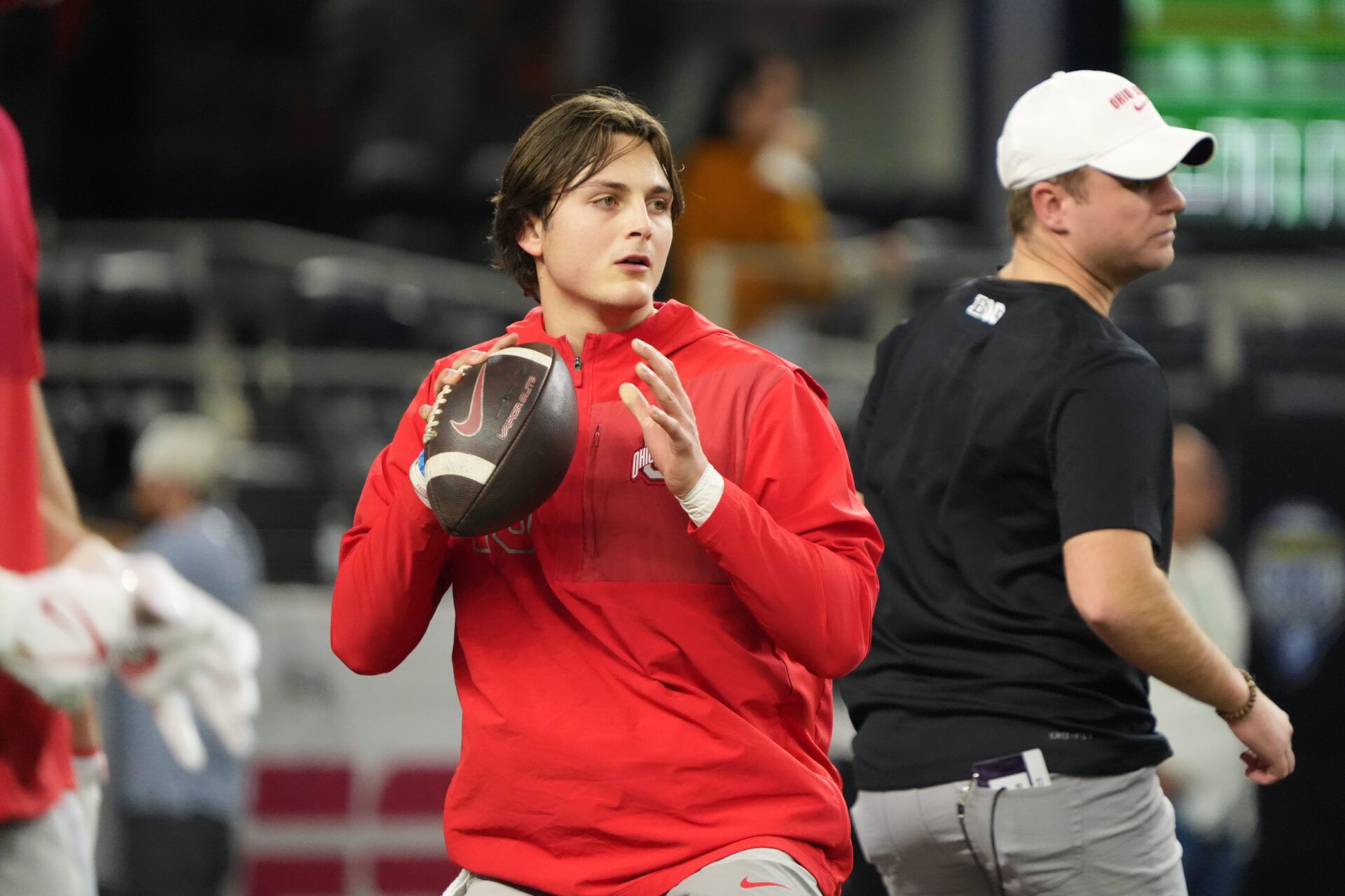 Ohio State Buckeyes quarterback Julian Sayin (10) warms up before the 2025 Cotton Bowl and quarterfinal game of the College Football Playoff against the Miami Hurricanes at AT&T Stadium.