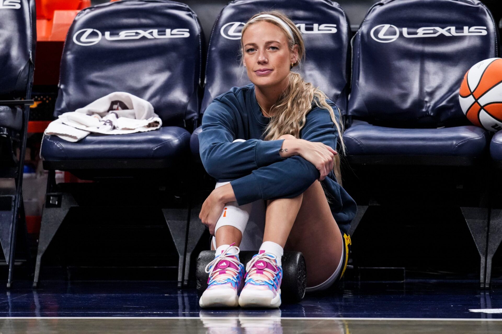 Indiana Fever guard Sophie Cunningham (8) sits on the sideline Thursday, April 30, 2026, during a preseason game between the Indiana Fever and the Dallas Wings at Gainbridge Fieldhouse in Indianapolis.