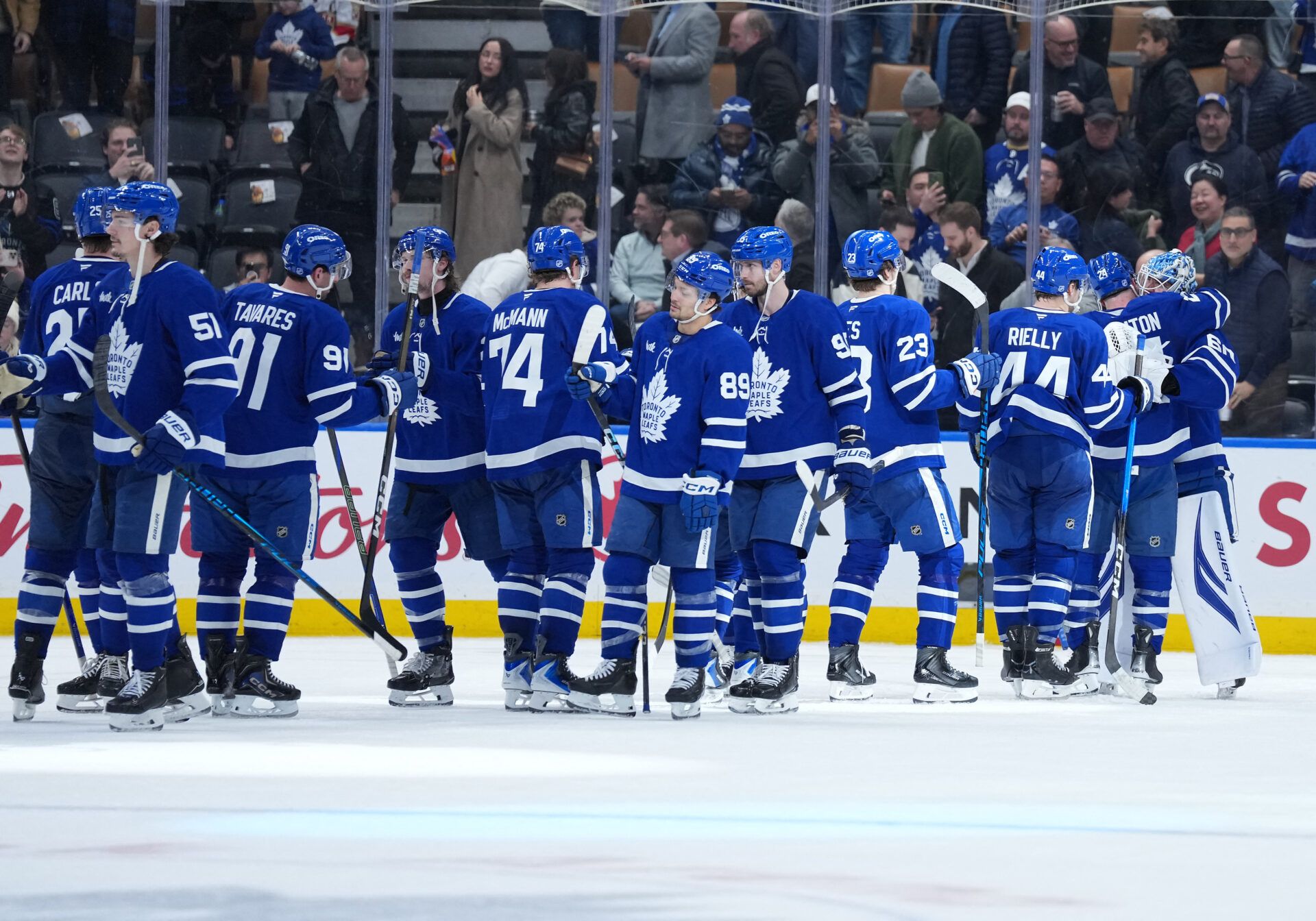 The Toronto Maple Leafs players celebrate the win at Scotiabank Arena.