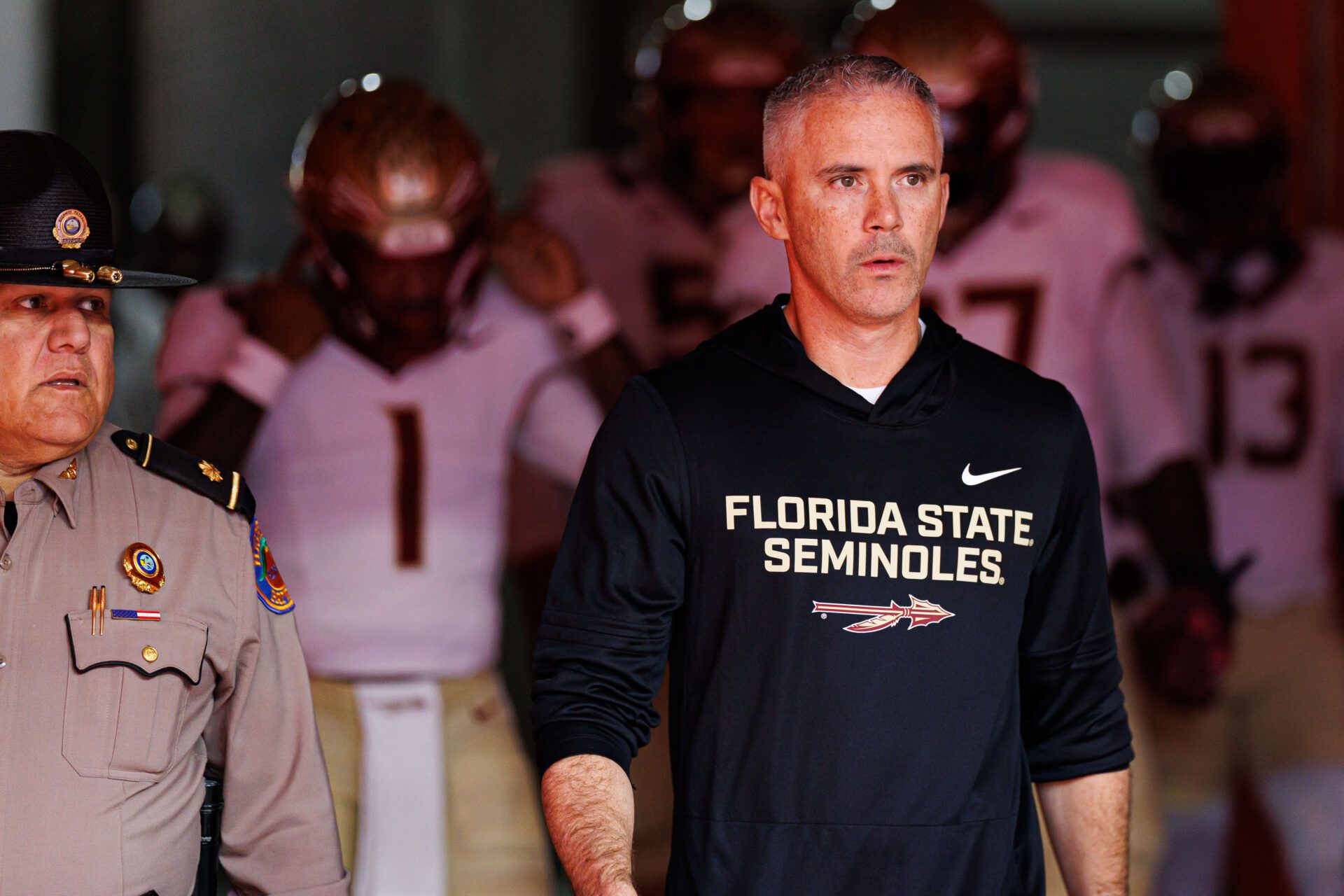 Florida State Seminoles head coach Mike Norvell walks out of the tunnel before a game against the Florida Gators at Ben Hill Griffin Stadium.