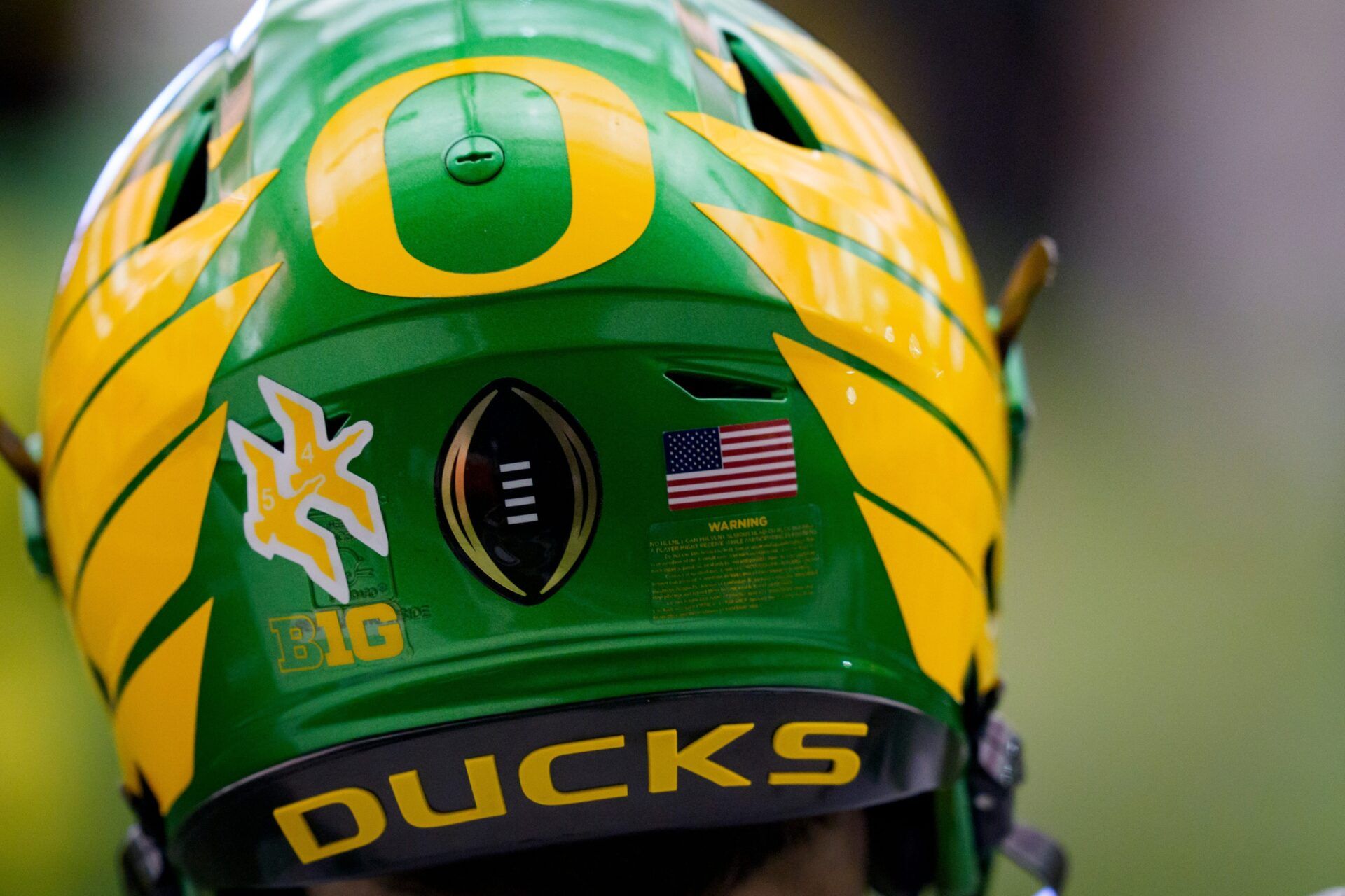 The College Football Playoff logo adorns a helmet during an open practice ahead of the Orange Bowl at the Moshofsky Center in Eugene, Oregon on Dec. 27, 2025.