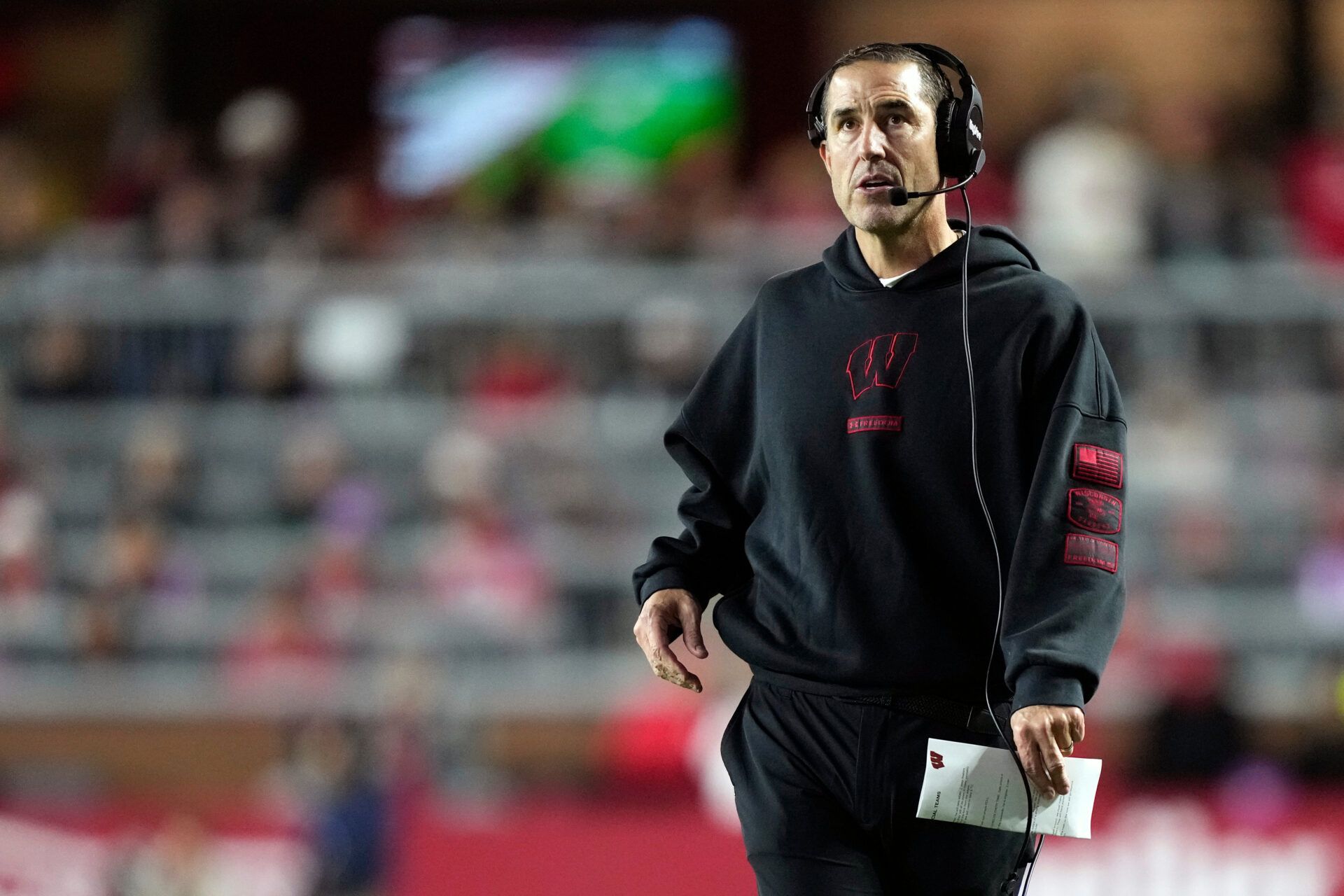 Wisconsin Badgers head coach Luke Fickell looks on during a timeout  in the second half against the Illinois Fighting Illini at Camp Randall Stadium.
