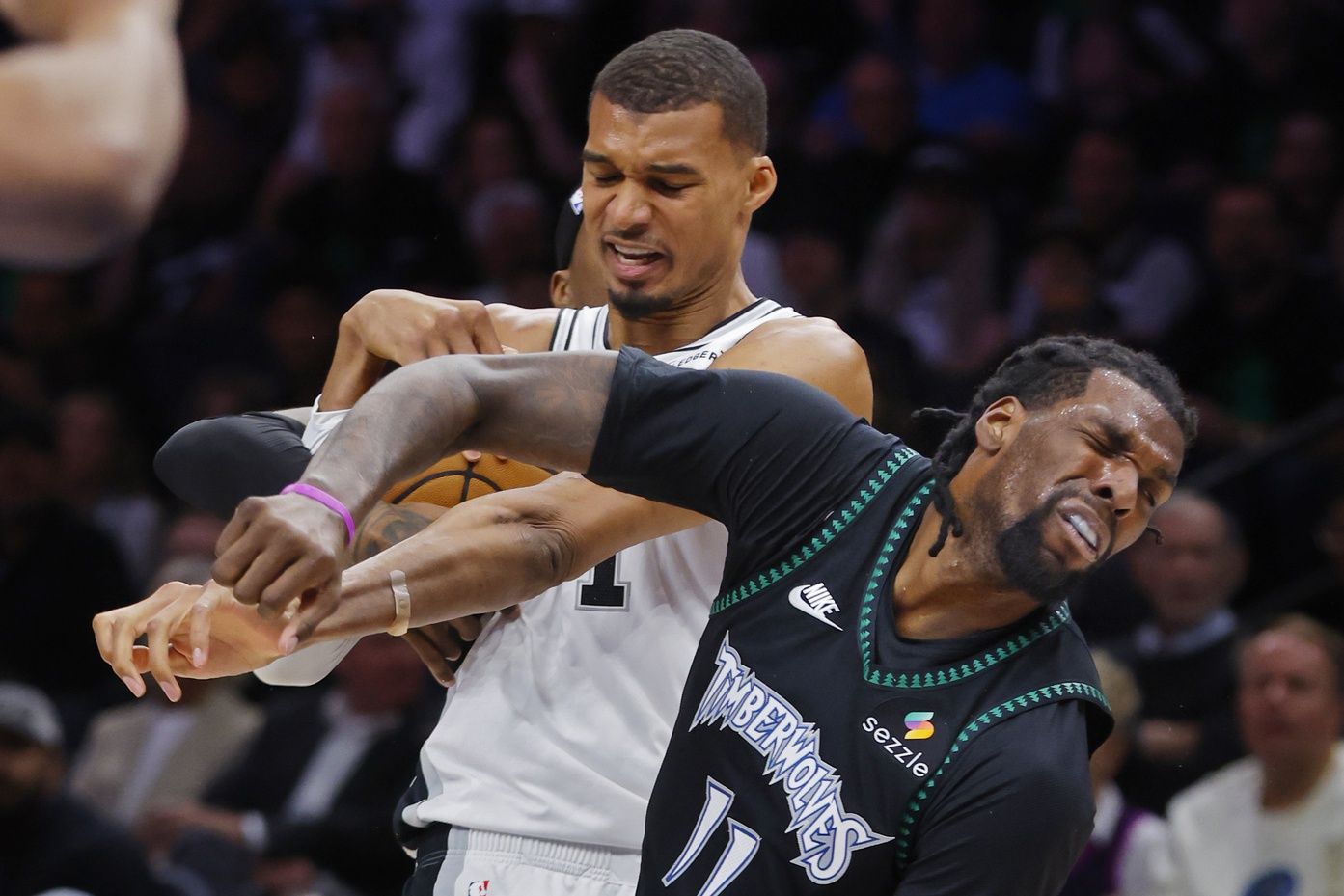 San Antonio Spurs center Victor Wembanyama (1) commits a level two flagrant foul against Minnesota Timberwolves center Naz Reid (11) in the second quarter of game four of the second round of the 2026 NBA Playoffs at Target Center. Wembanyama had to leave the game.