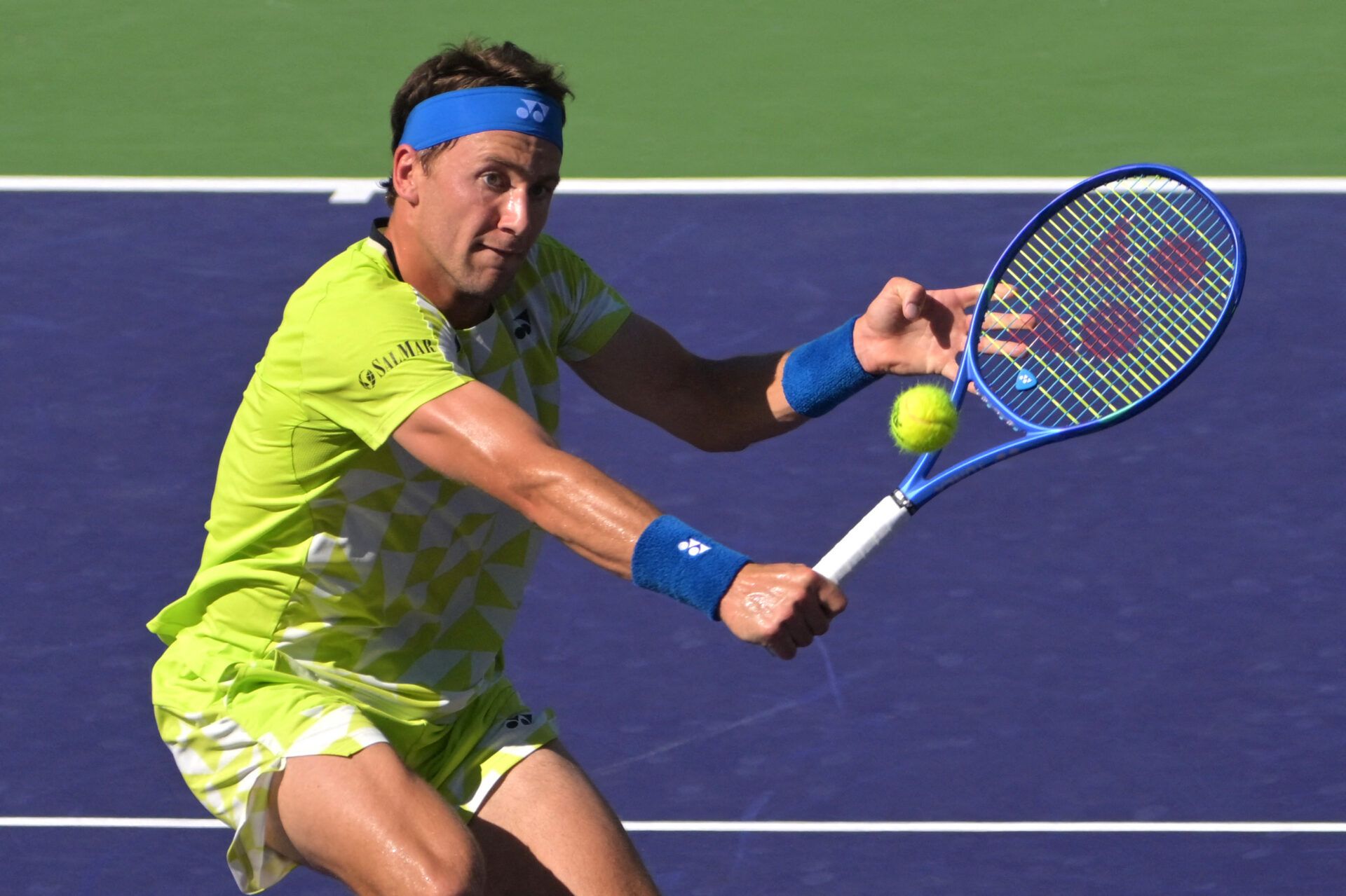 Casper Ruud (NOR) hits a shot during the fourth round match against Carlos Alcaraz (ESP) in the BNP Paribas Open at the Indian Wells Tennis Garden.
