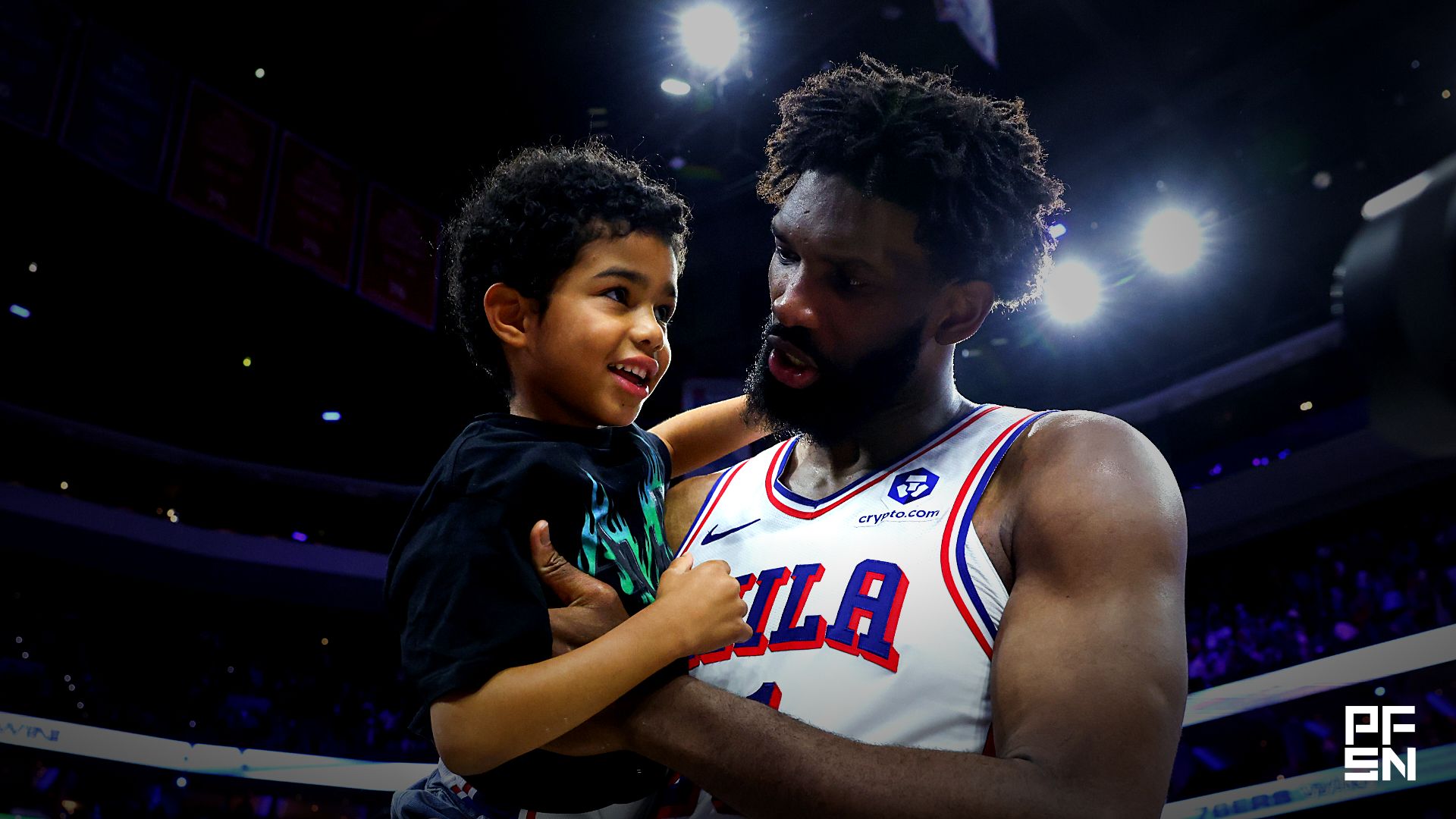 Philadelphia 76ers center Joel Embiid (21) carries his son Arthur on the court after a victory against the Boston Celtics at Xfinity Mobile Arena.