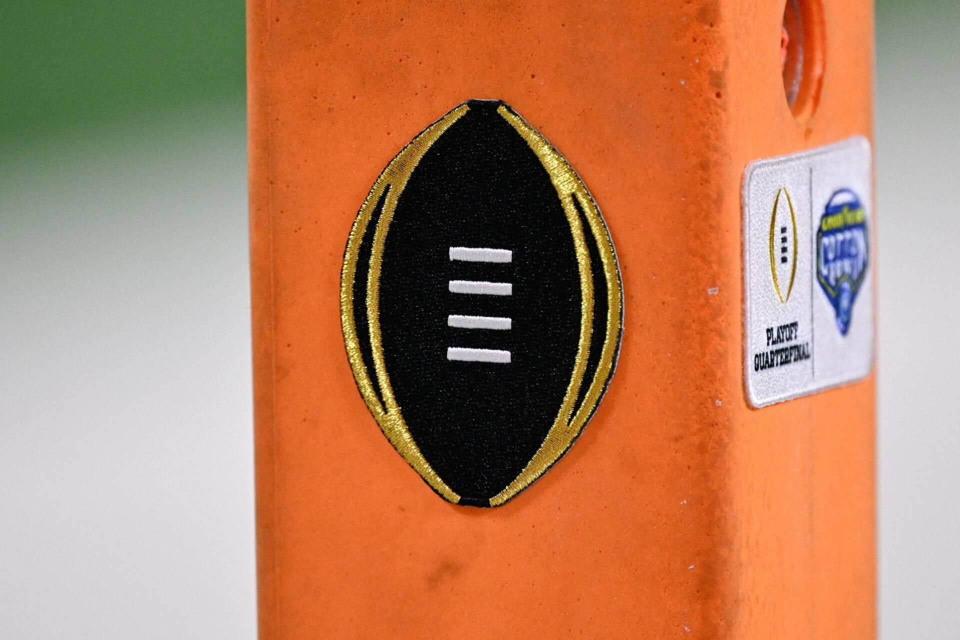 A detailed view of the College Football Playoff logo on the pylon during the game between the Miami Hurricanes and Ohio State Buckeyes during the 2025 Cotton Bowl and quarterfinal game of the College Football Playoff at AT&T Stadium.
