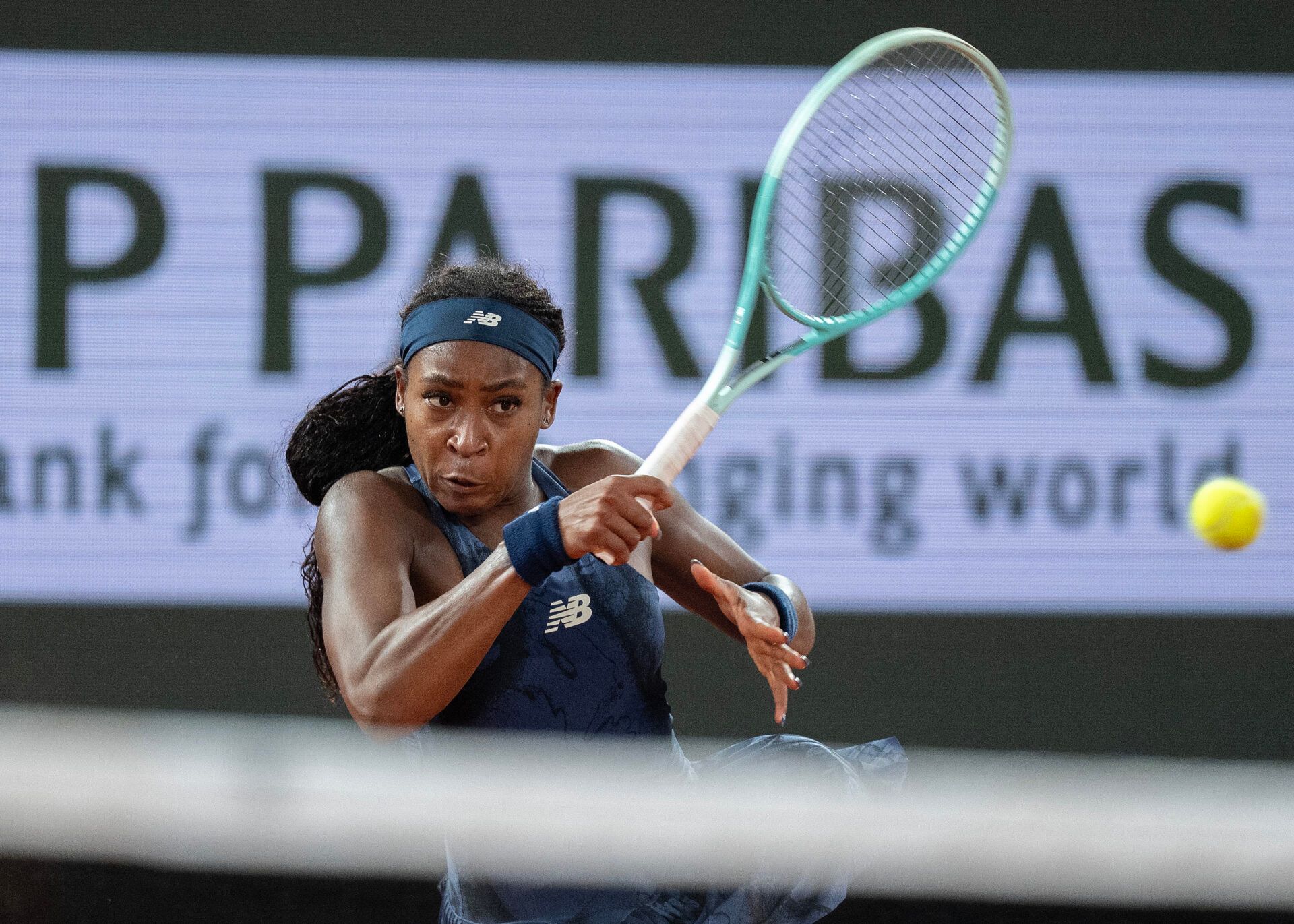Coco Gauff of the United States returns a shot during her match against Lois Boisson of France on day 12 at Roland Garros Stadium.