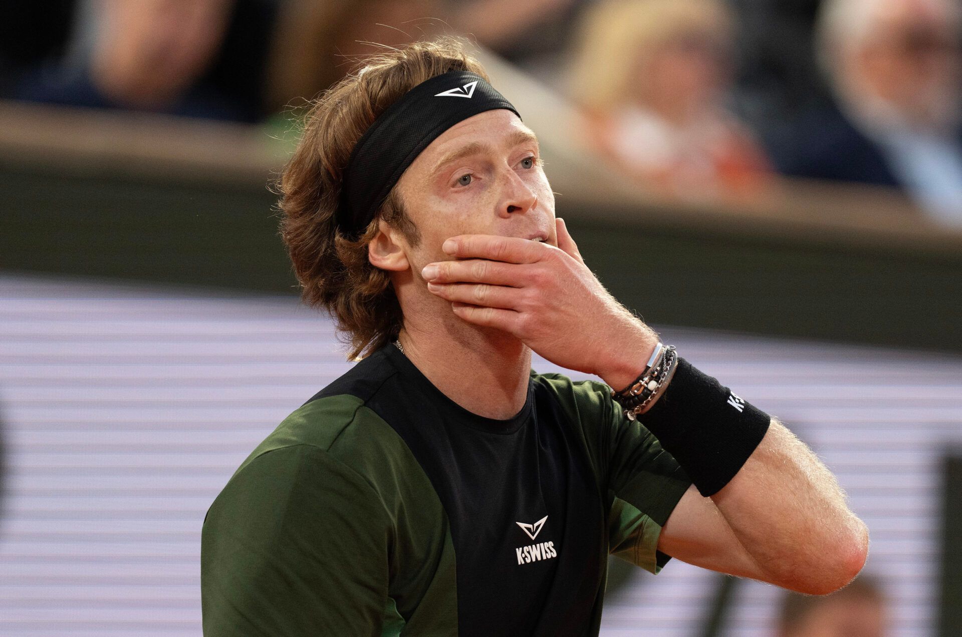 Andrey Rublev reacts to a point during his match against Jannik Sinner of Italy on day nine at Roland Garros Stadium.