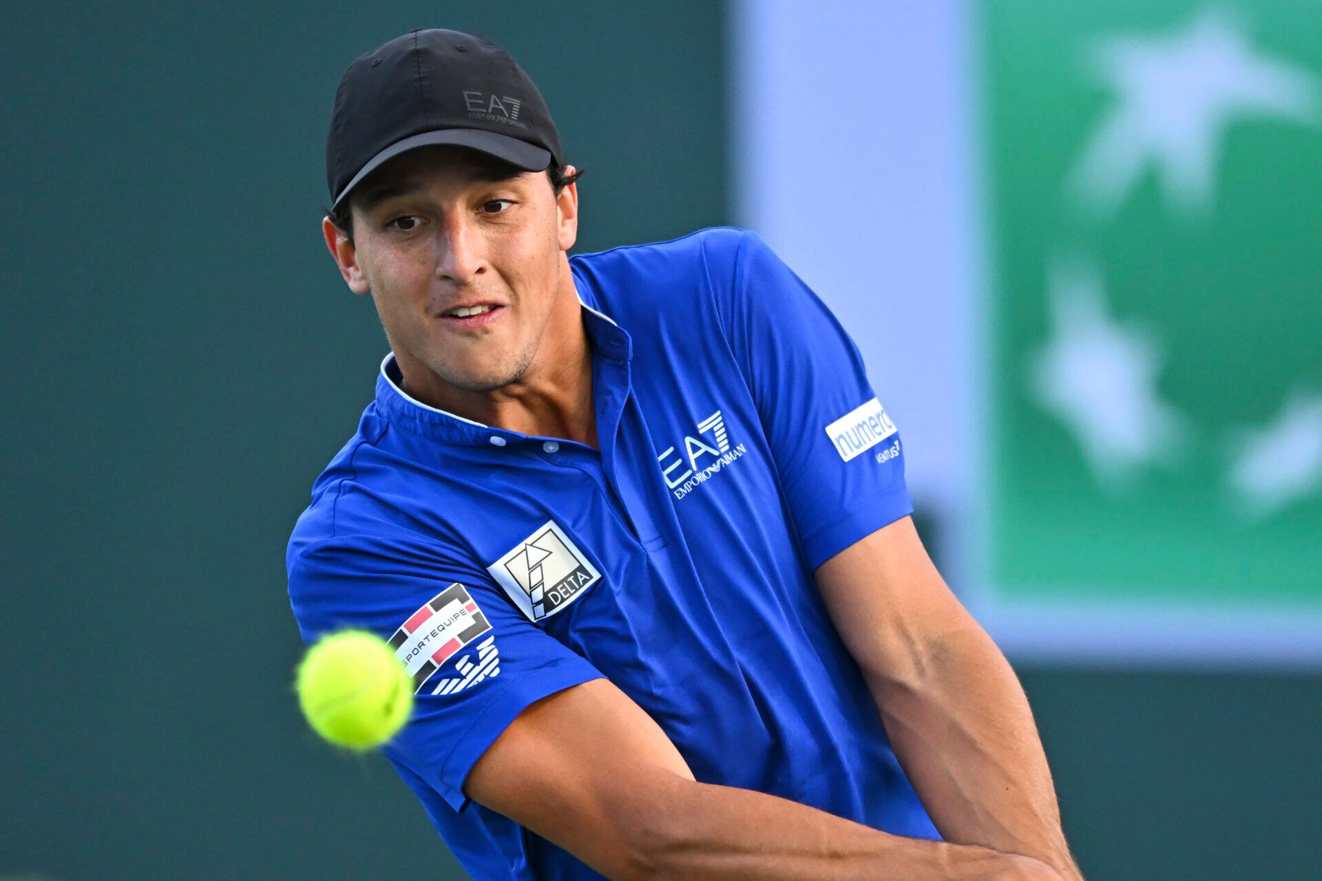 Luciano Darderi (ITA) hits a ball against Hugo Gaston (FRA) in the BNP Paribas Open at the Indian Well Tennis Garden.