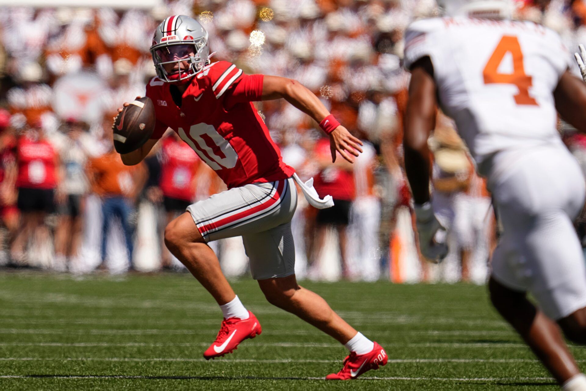 Ohio State Buckeyes quarterback Julian Sayin (10) runs during the first half of the NCAA football game against the Texas Longhorns at Ohio Stadium on Aug. 30, 2025.