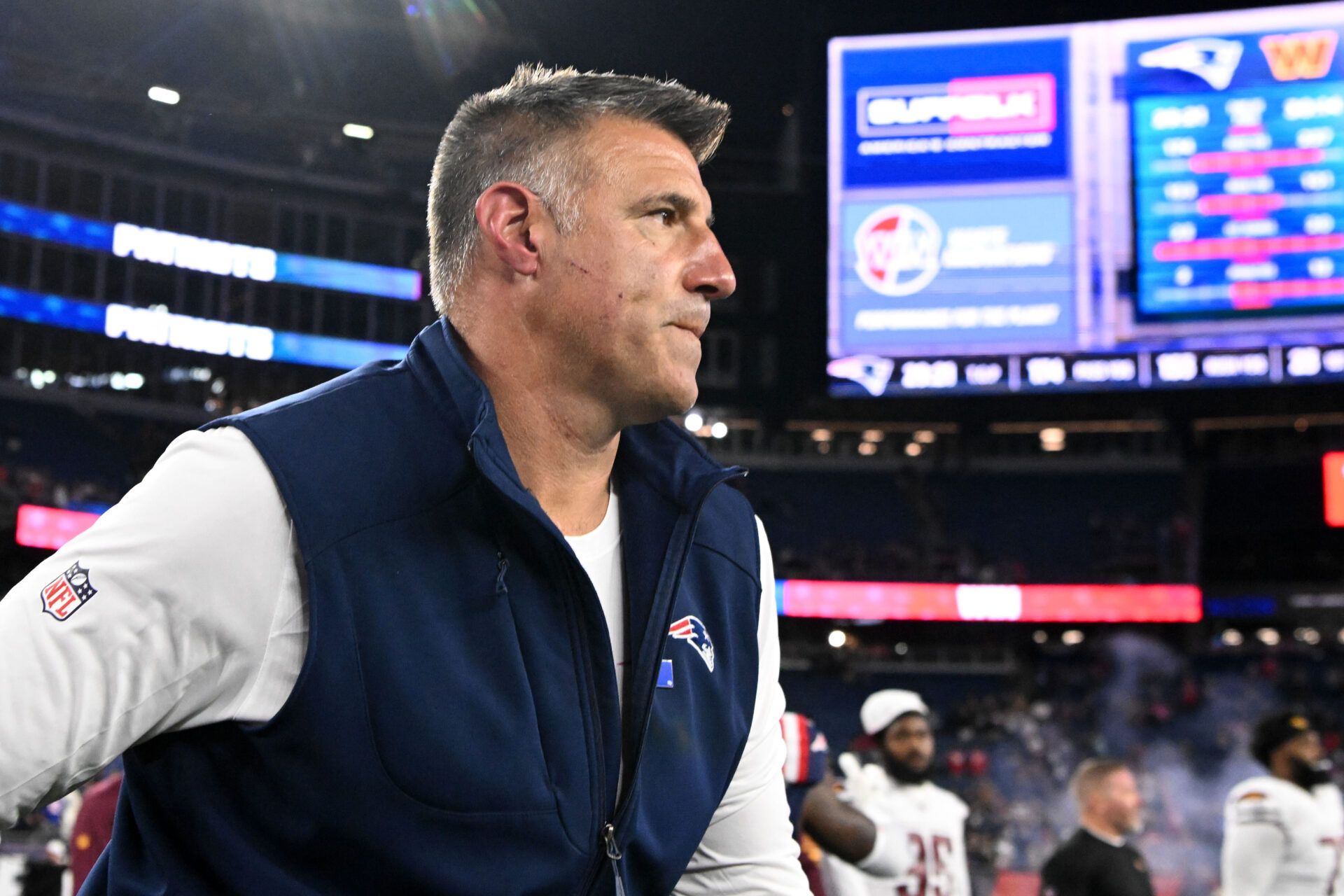 New England Patriots head coach Mike Vrabel walks off of the field after a game against the Washington Commanders at Gillette Stadium.