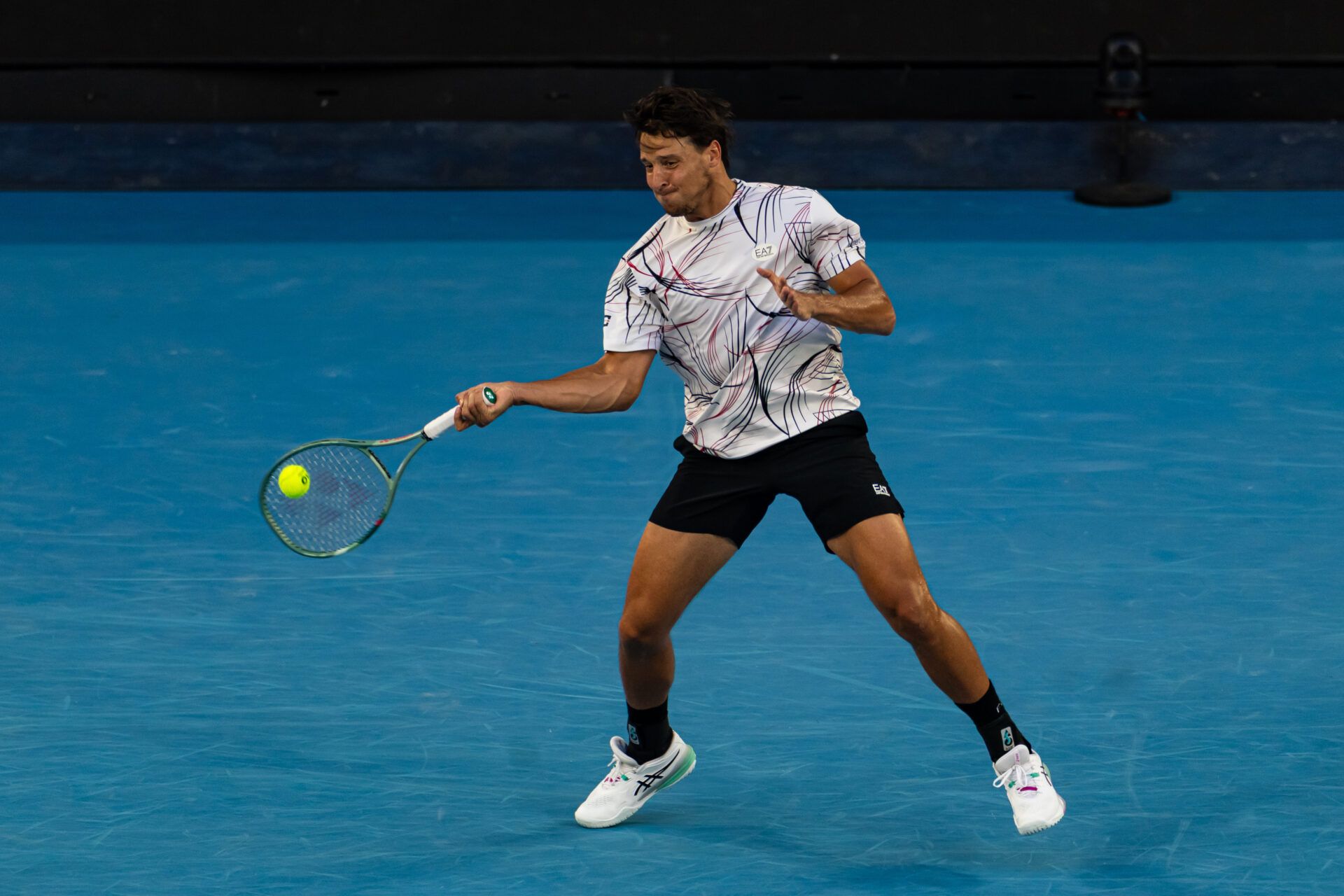 Luciano Darderi of Italy in action against Jannik Sinner of Italy in the fourth round of the mens singles at the Australian Open at Margaret Court Arena in Melbourne Park.