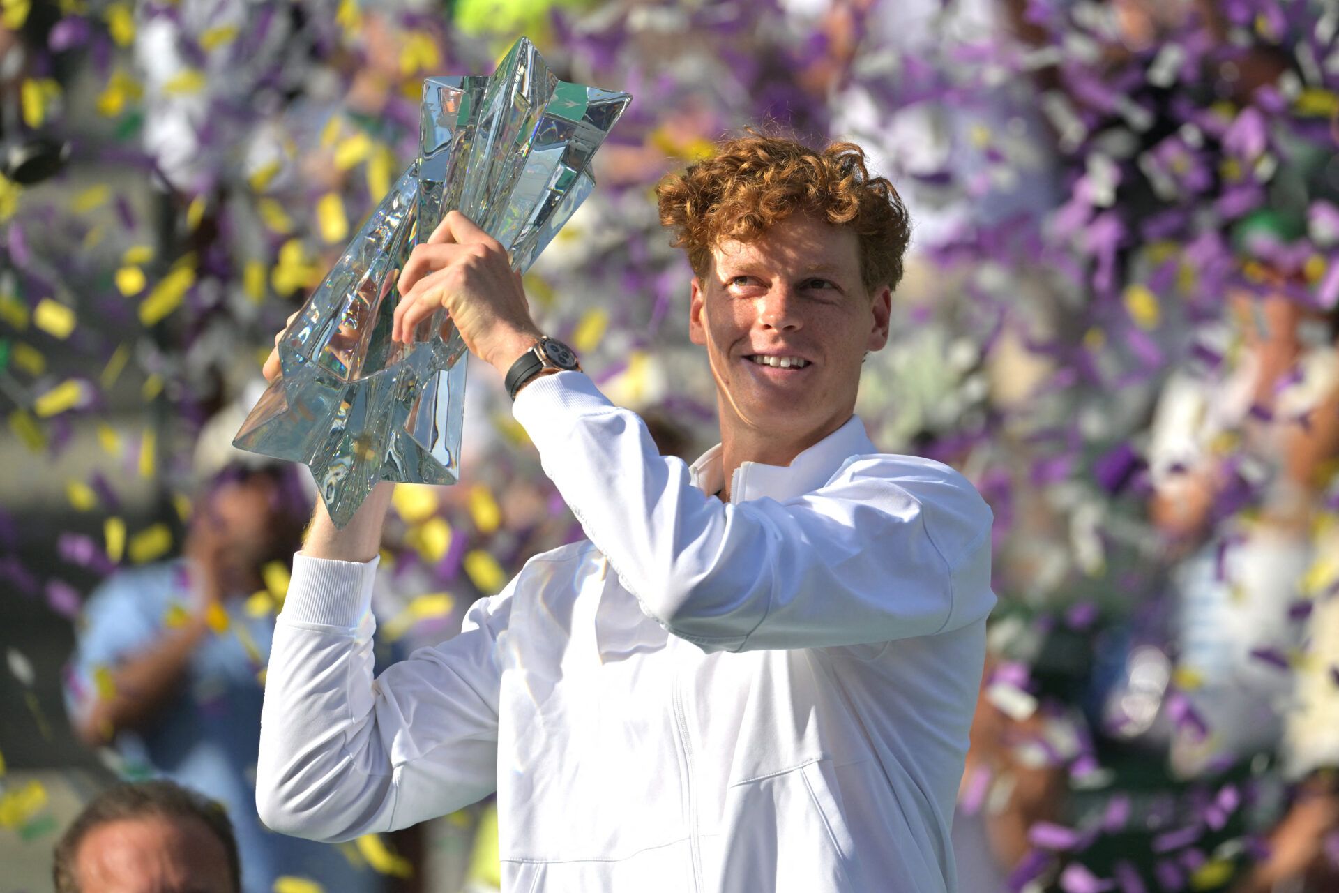 Jannik Sinner (ITA) celebrates with the championship trophy after he defeated Daniil Medvedev (RUS) in the menÕs final of the BNP Paribas Open at the Indian Wells Tennis Garden.