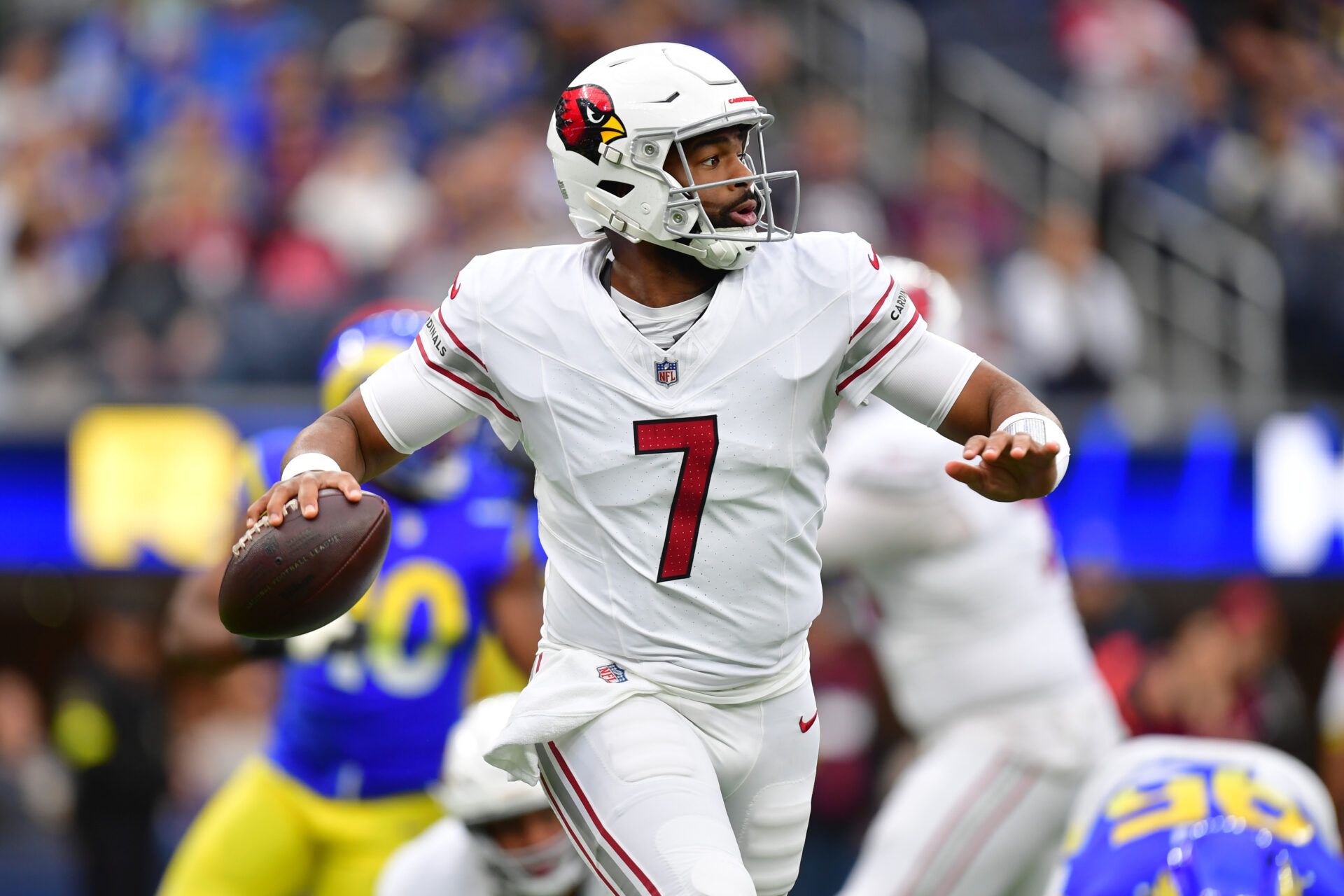 Arizona Cardinals quarterback Jacoby Brissett (7) looks to throw downfield against the Los Angeles Rams during the first half at SoFi Stadium.