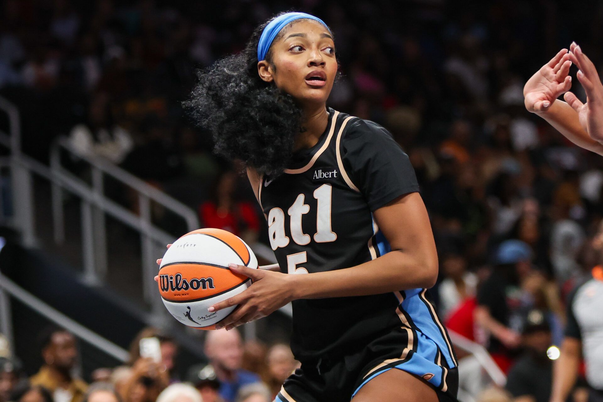 Atlanta Dream forward Angel Reese (5) handles the ball against the Las Vegas Aces in the fourth quarter at State Farm Arena.