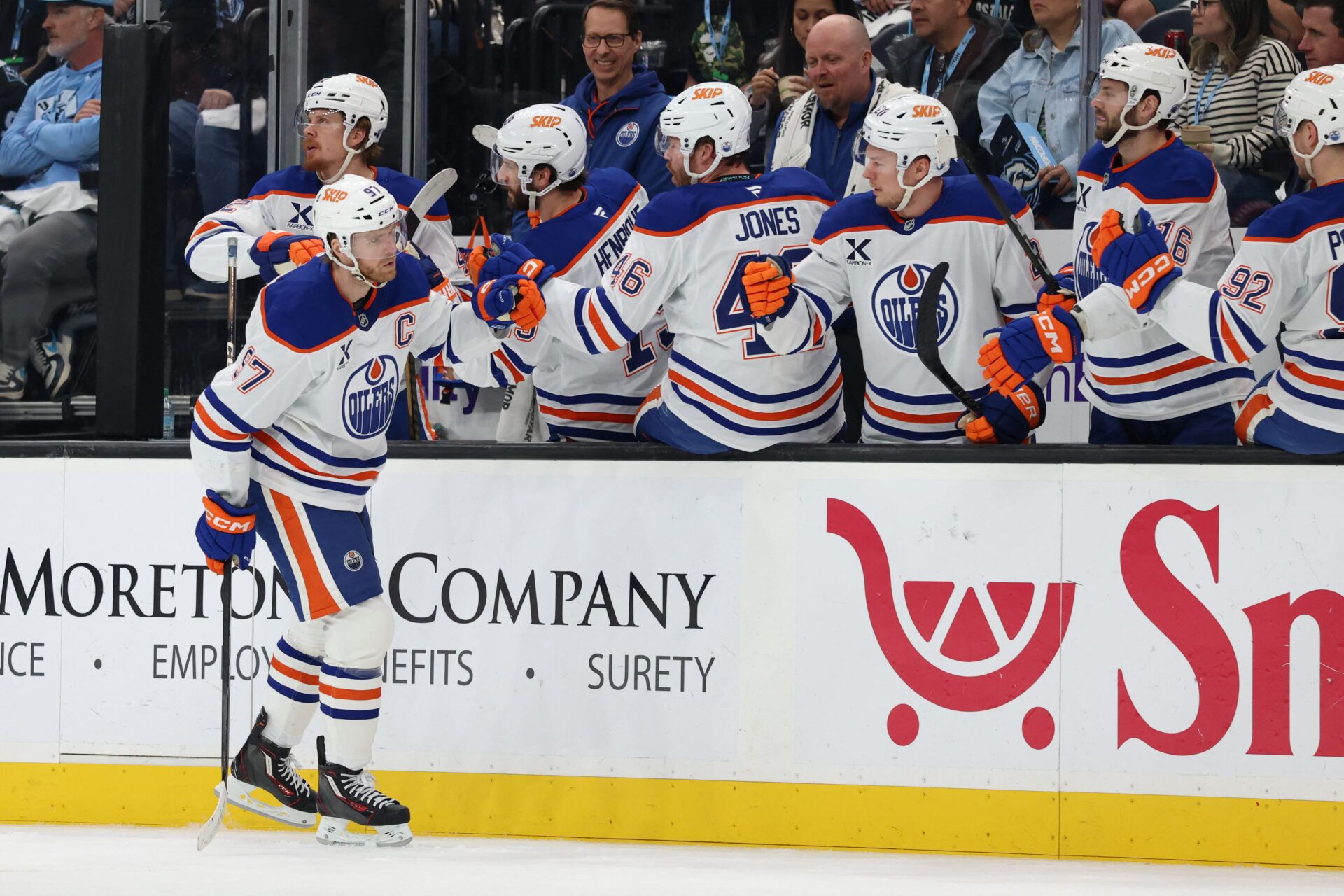 Edmonton Oilers center Connor McDavid (97) celebrates with the bench player at Delta Center.