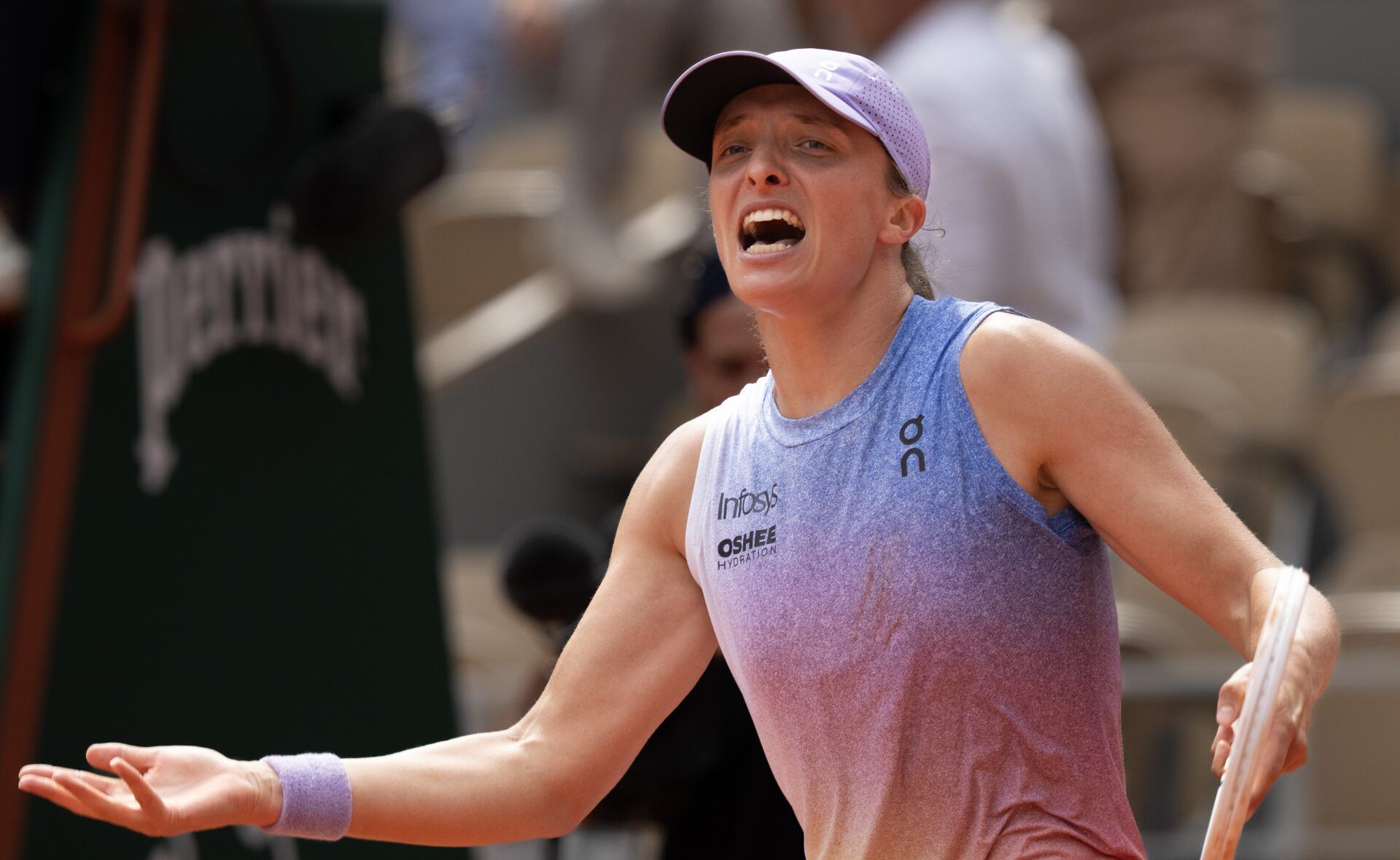 Iga Swiatek of Poland celebrates winning her match against Elena Rybakina of Kazakhstan on day eight at Roland Garros Stadium.