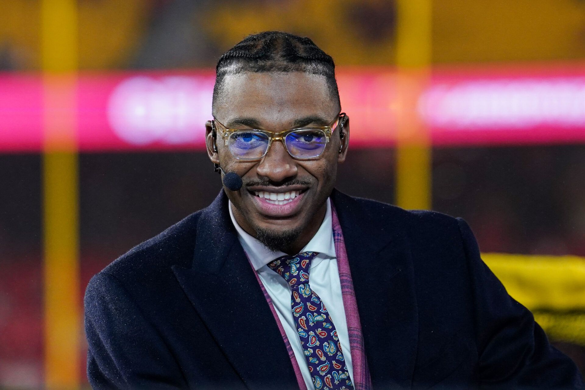 Monday Night Football commentator Robert Griffin III at the broadcast desk prior to a game between the Kansas City Chiefs and Philadelphia Eagles at GEHA Field at Arrowhead Stadium.
