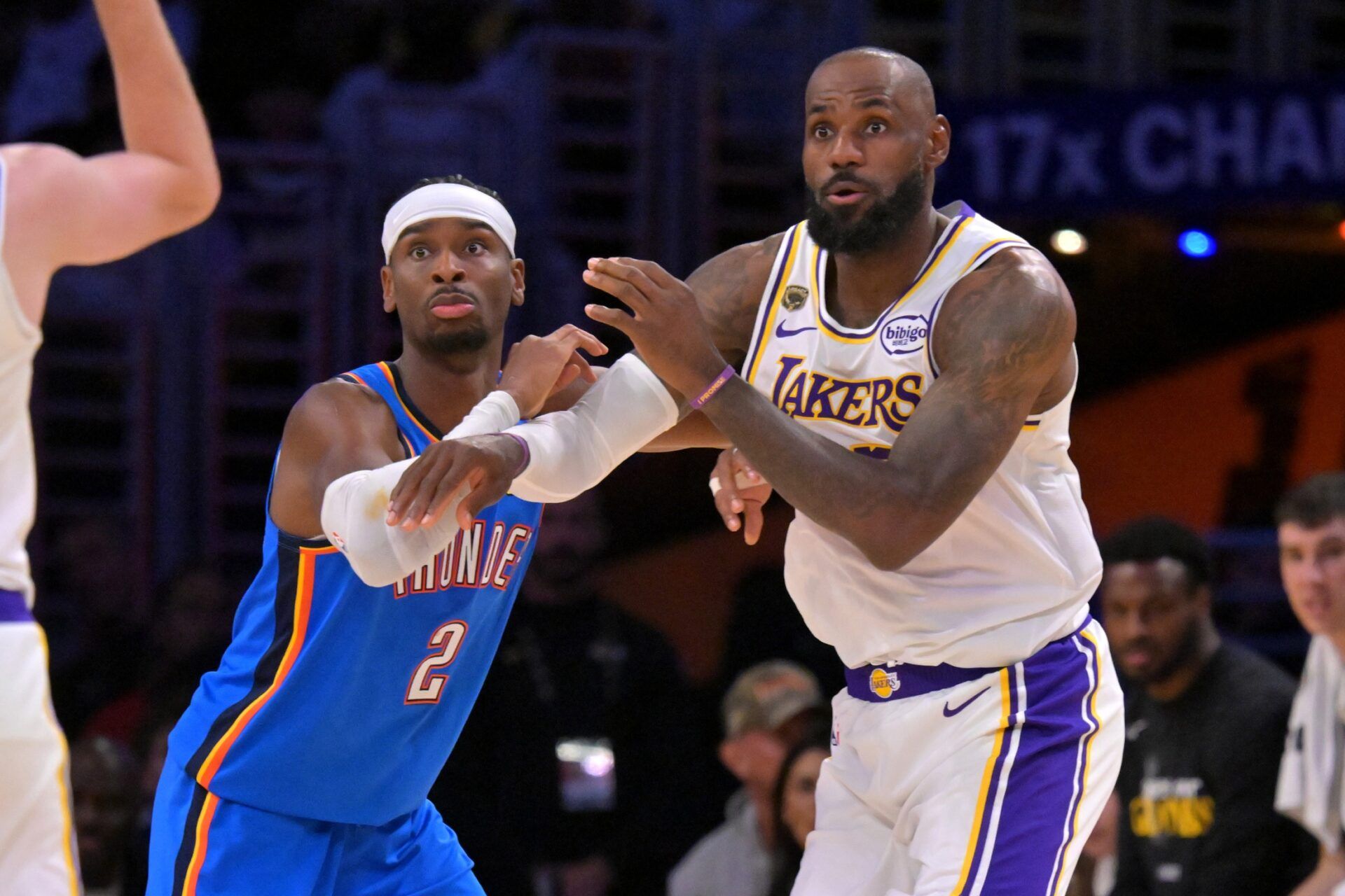 Oklahoma City Thunder guard Shai Gilgeous-Alexander (2) defends Los Angeles Lakers forward LeBron James (23) in the second half of game three of the second round of the 2026 NBA Playoffs at Crypto.com Arena.