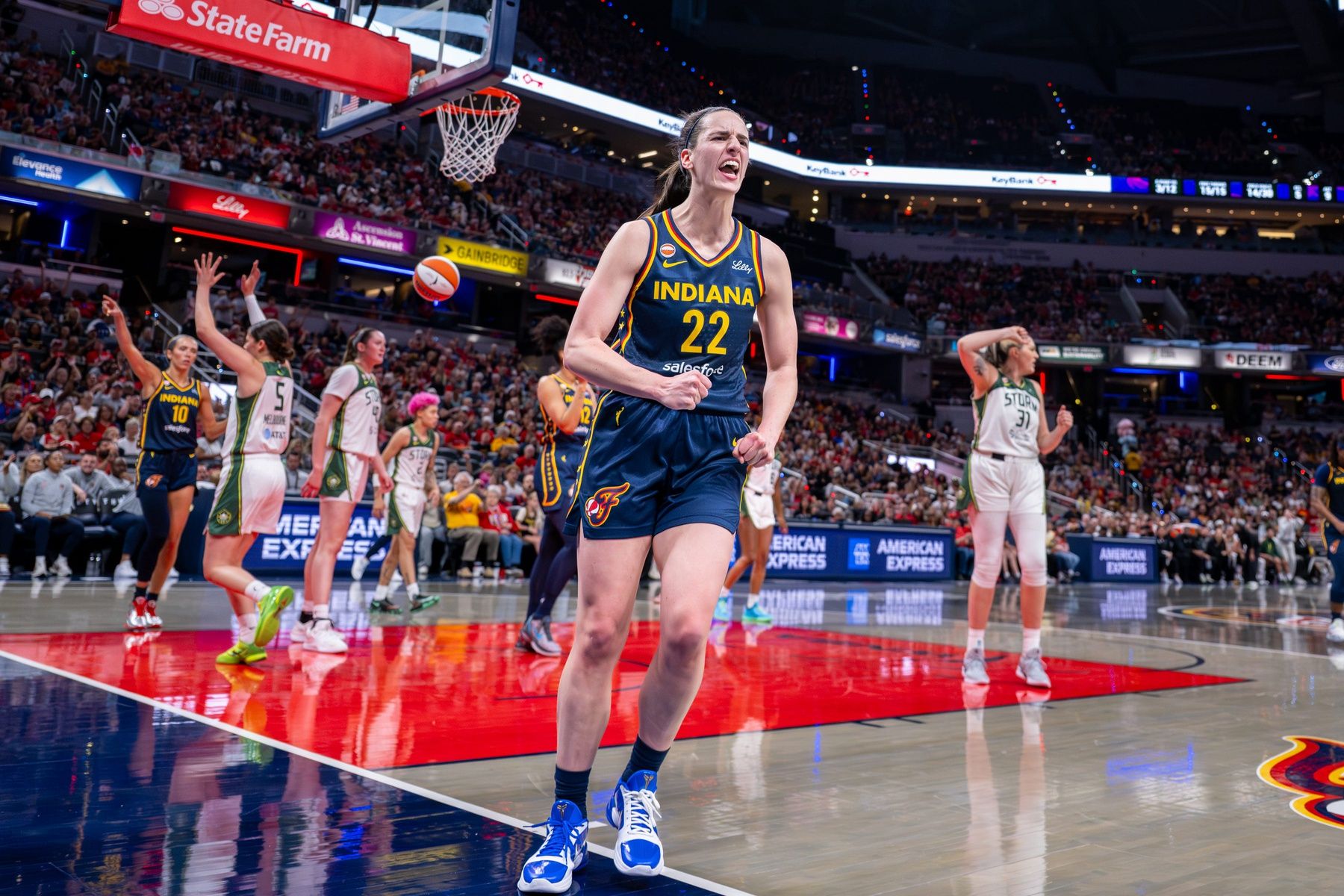 Indiana Fever guard Caitlin Clark (22) reacts after being fouled on a play while scoring during the first half of an WNBA basketball game against the Seattle Storm, Sunday, May 17, 2026, at Gainbridge Fieldhouse.