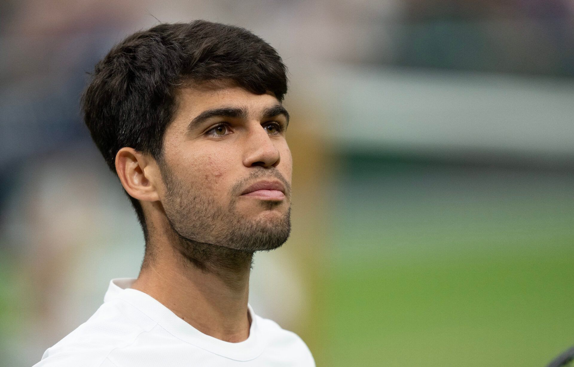 Carlos Alcaraz of Spain looks on during his match against Andrey Rublev on day seven at the All England Lawn Tennis and Croquet Club.
