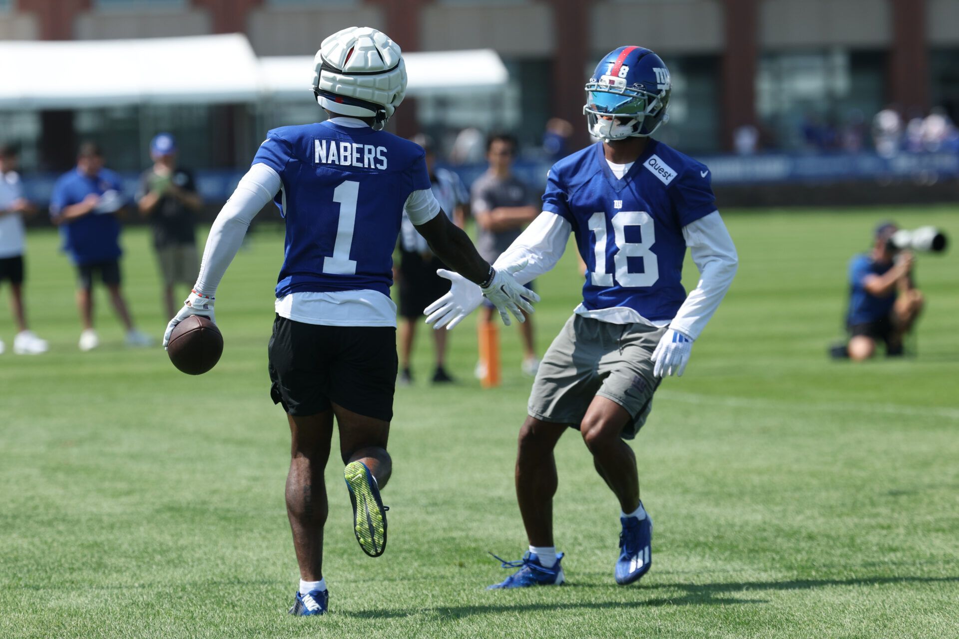 New York Giants wide receiver Malik Nabers (1) and New York Giants wide receiver Darius Slayton (18) celebrate during training camp at Quest Diagnostics Training Center.