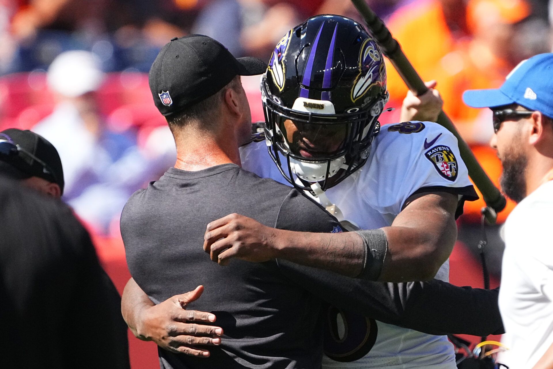 Baltimore Ravens head coach John Harbaugh and quarterback Lamar Jackson (8) prior to the game against the Denver Broncos at Empower Field at Mile High.