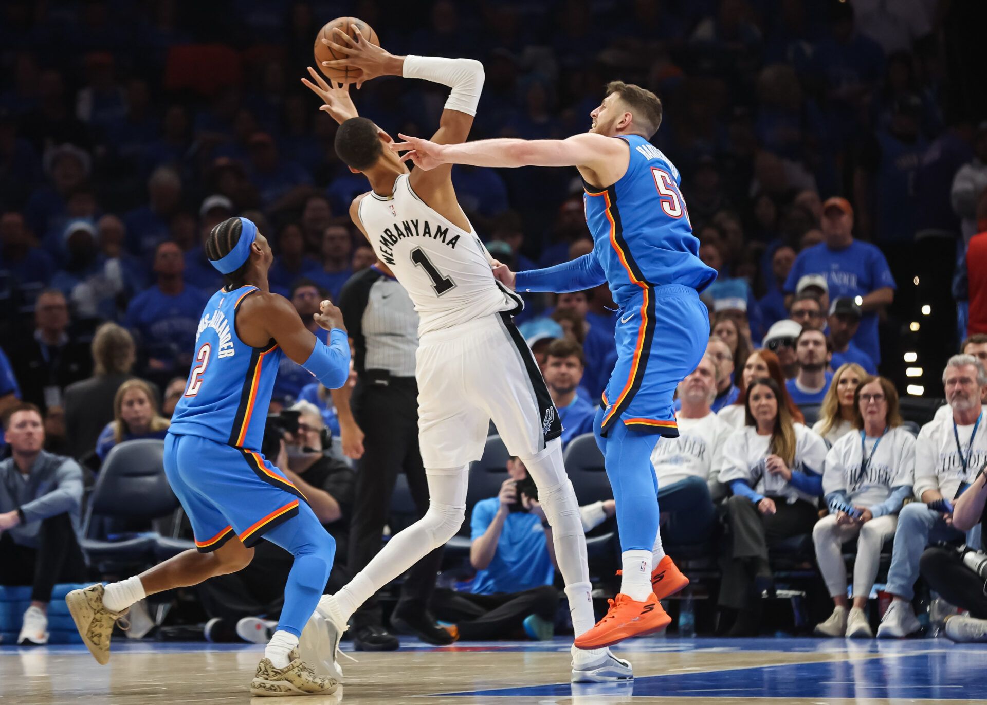 San Antonio Spurs forward Victor Wembanyama (1) shoots as Oklahoma City Thunder center Isaiah Hartenstein (55) defends during the third quarter during game two of the western conference finals for the 2026 NBA playoffs at Paycom Center.