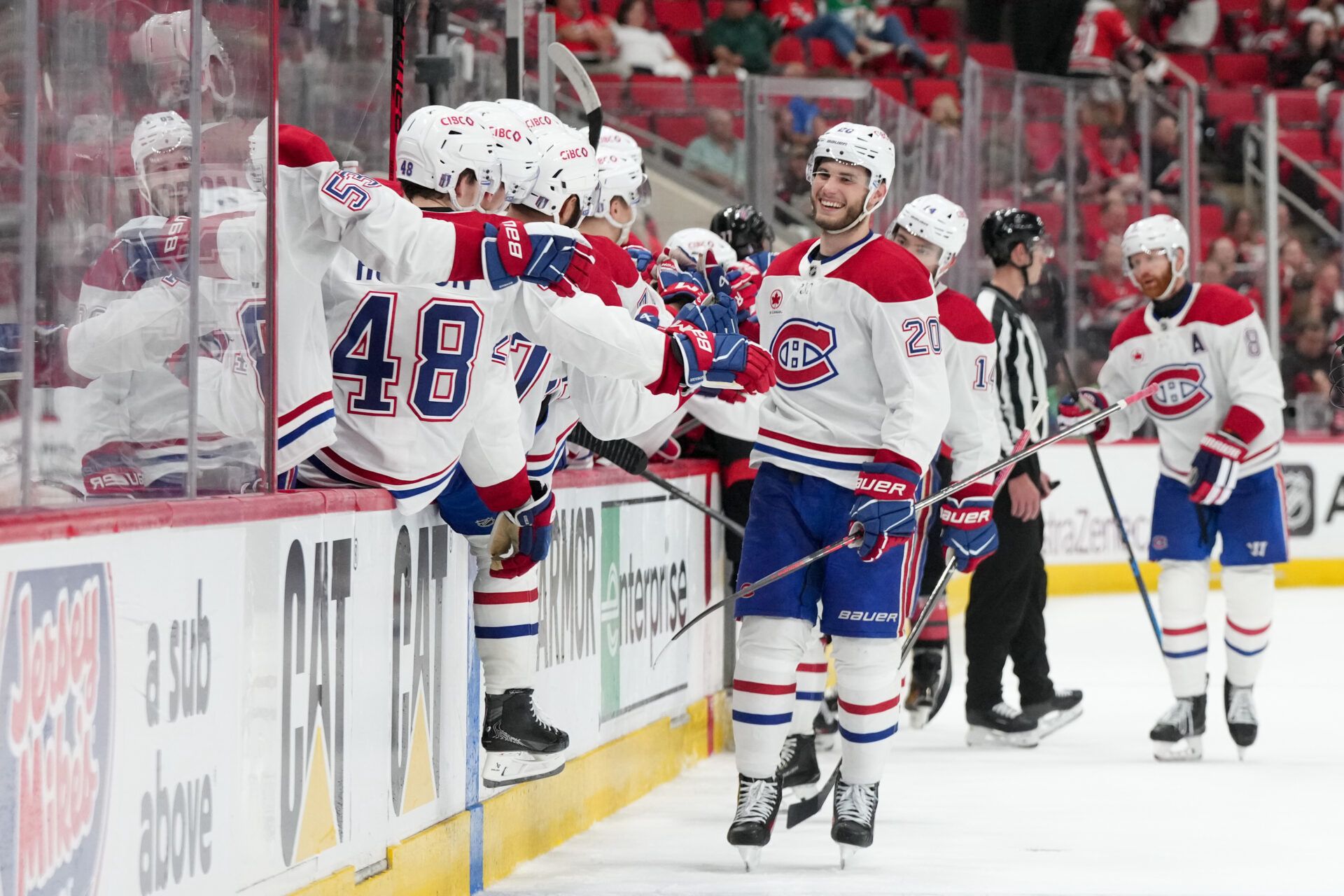 Montreal Canadiens left wing Juraj Slafkovsky (20) celebrates with teammates after scoring a goal against the Carolina Hurricanes during the third period in game one of the Eastern Conferene Final of the 2026 Stanley Cup Playoffs at Lenovo Center.