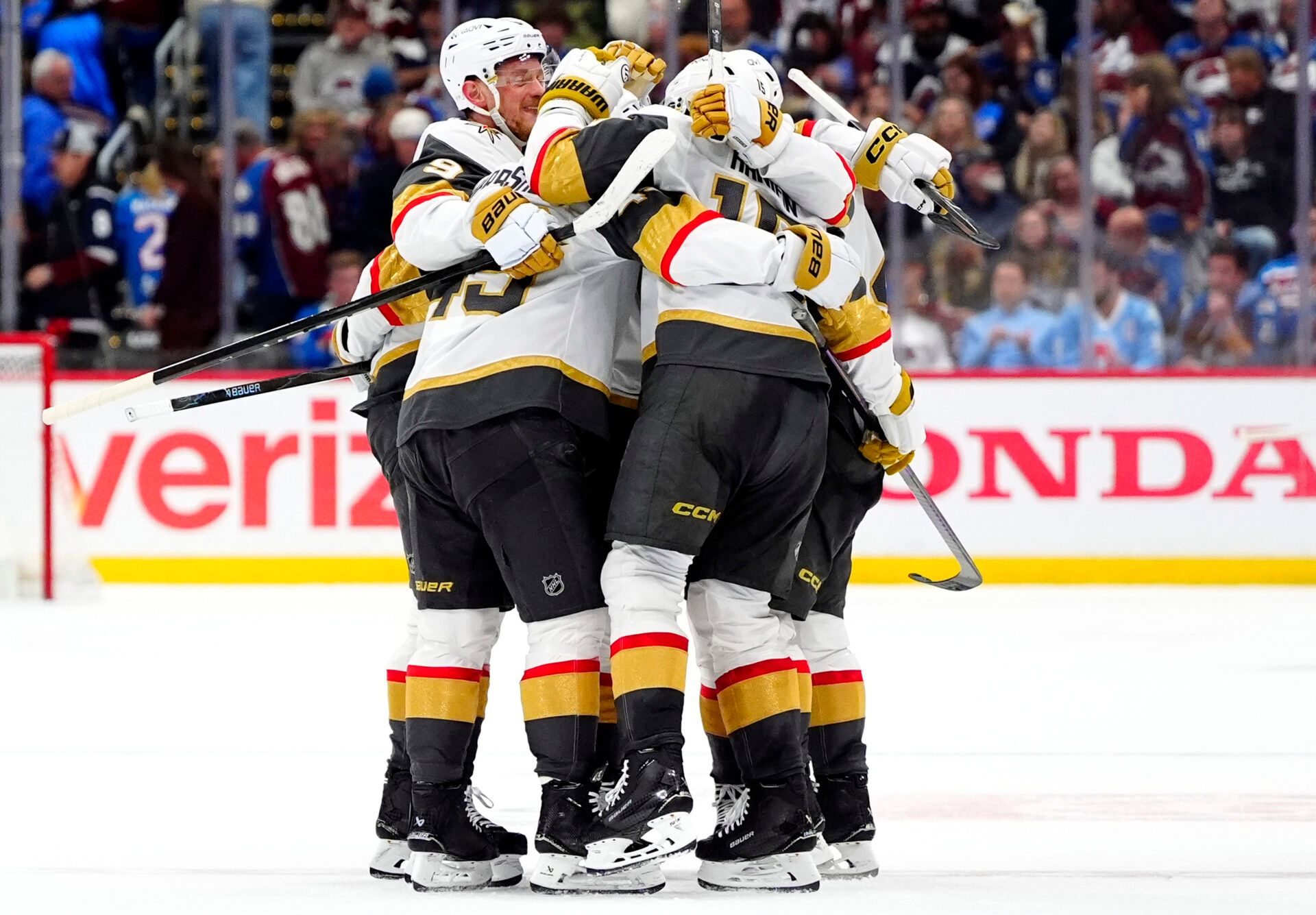 The Vegas Golden Knights celebrate a goal at Ball Arena.