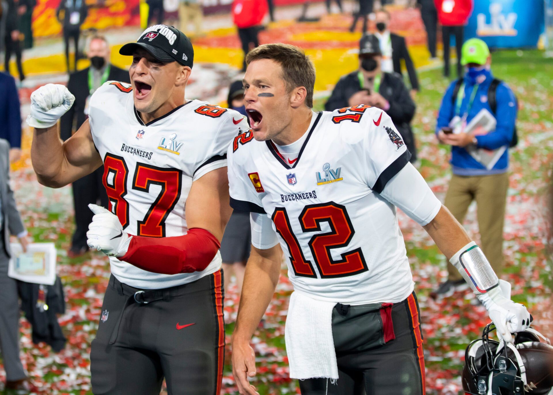 Tampa Bay Buccaneers quarterback Tom Brady (12) and tight end Rob Gronkowski (87) celebrate after beating the Kansas City Chiefs in Super Bowl LV at Raymond James Stadium.